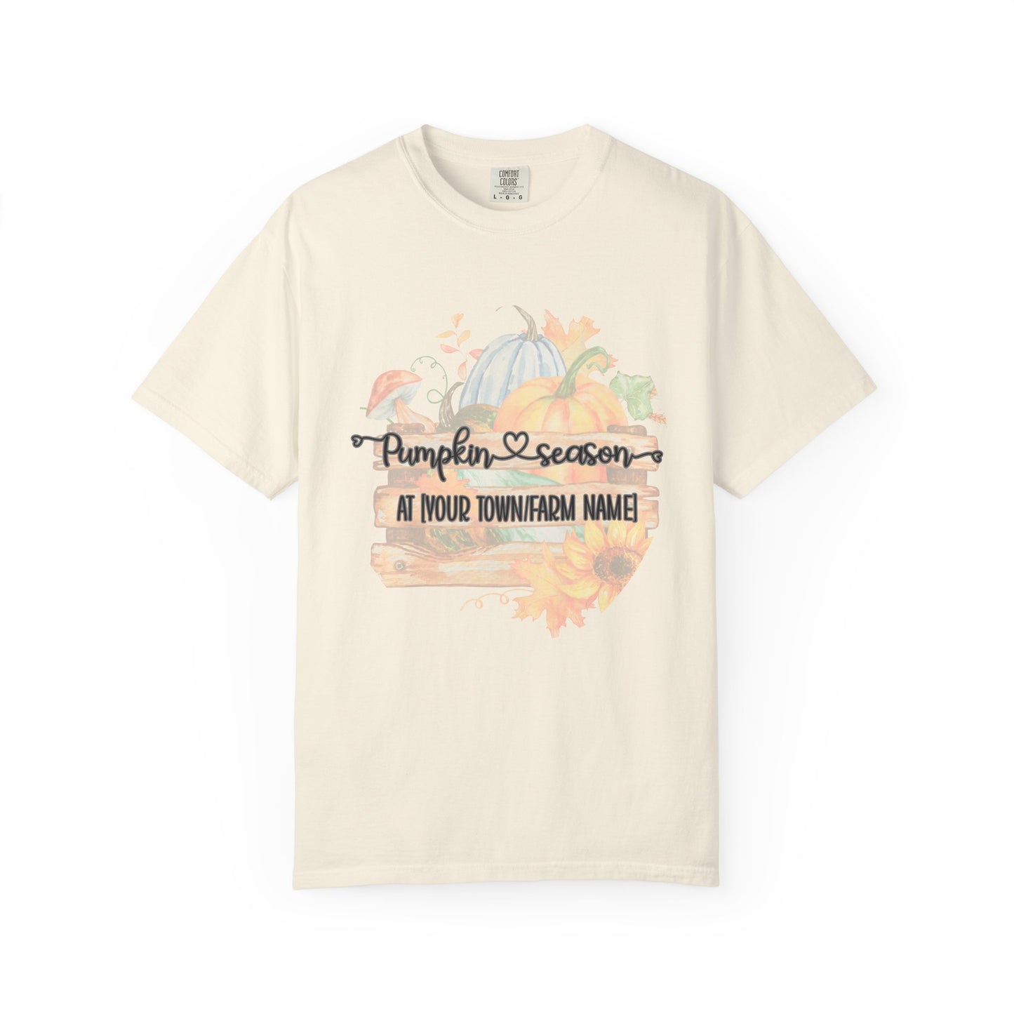 Beige t-shirt with pumpkin and autumn-themed design on a white background
