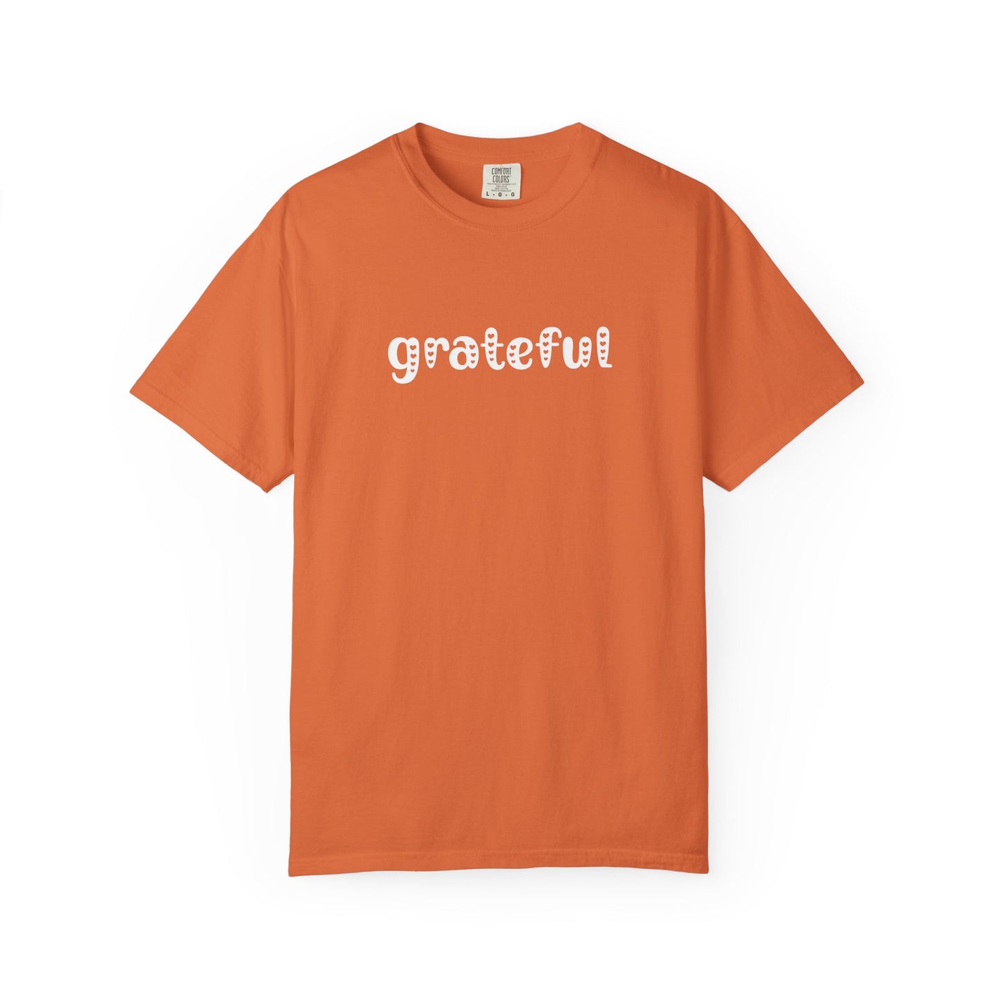 Orange t-shirt with 'grateful' text on a white background