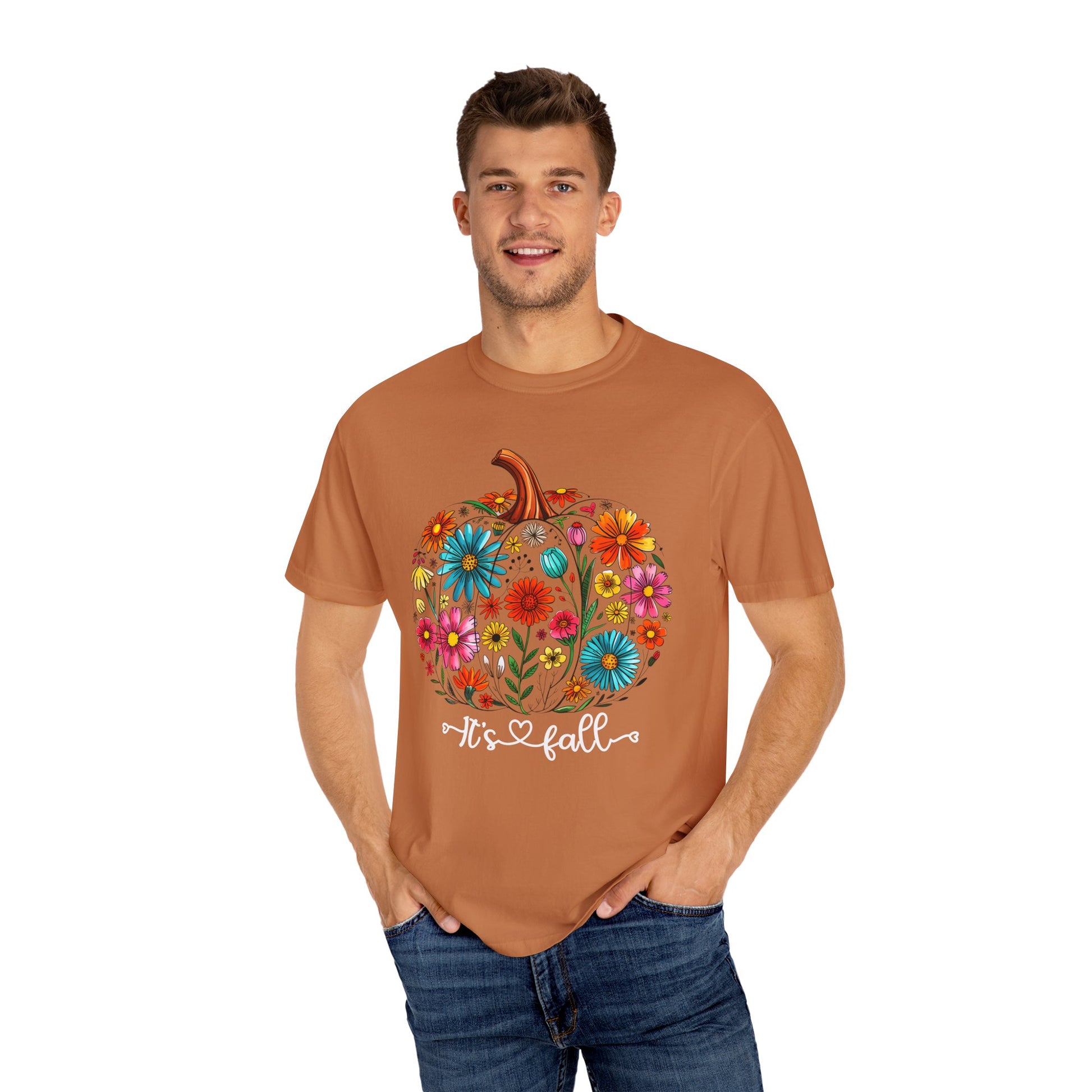 Man wearing a brown t-shirt with a colorful pumpkin design and 'It's fall' text on a white background