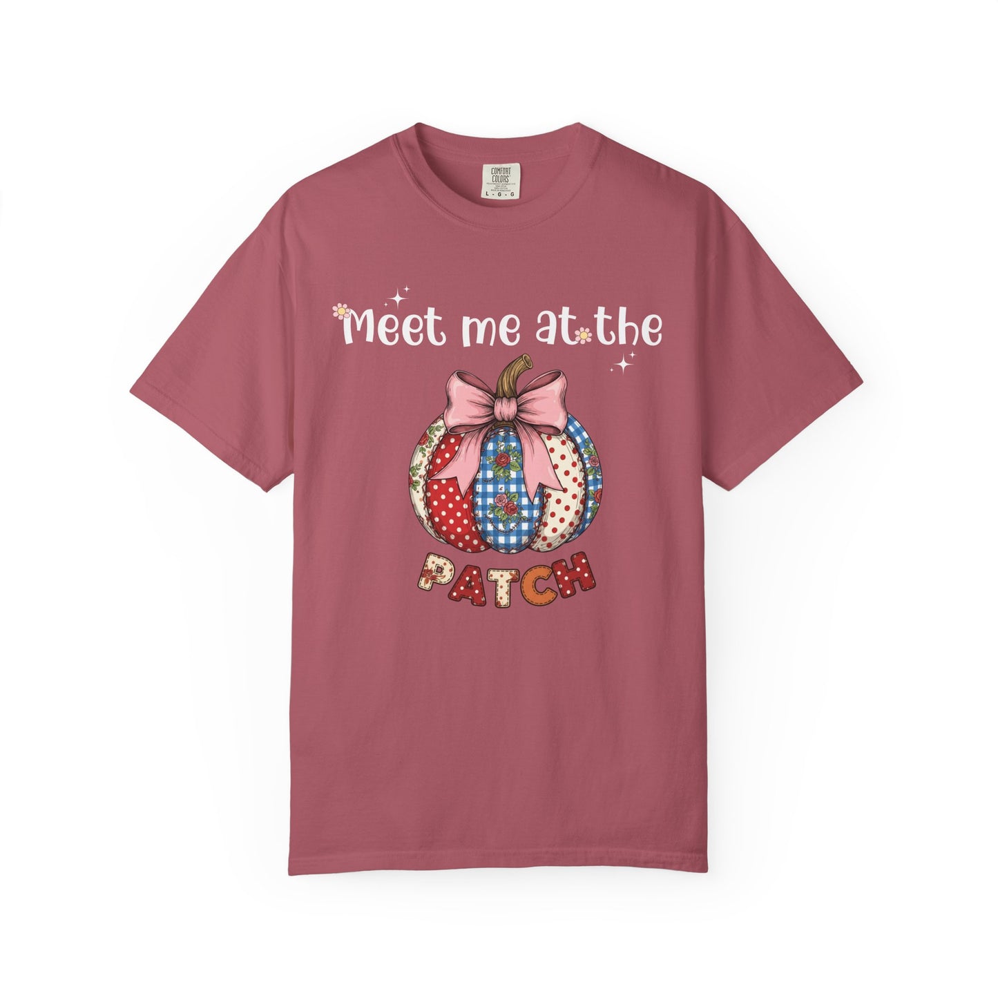 Pink t-shirt with a patchwork pumpkin design and text on a white background