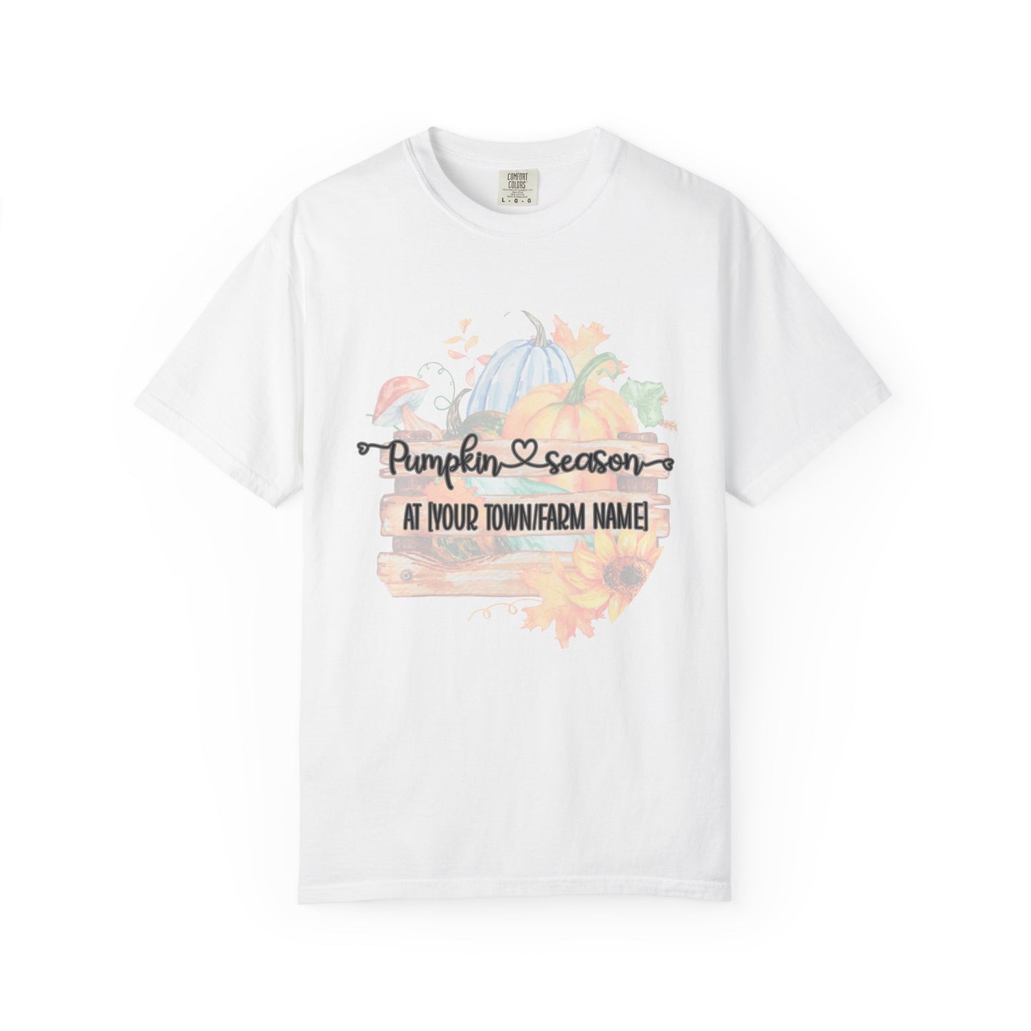 White t-shirt with pumpkin season graphic and placeholder text on a white background