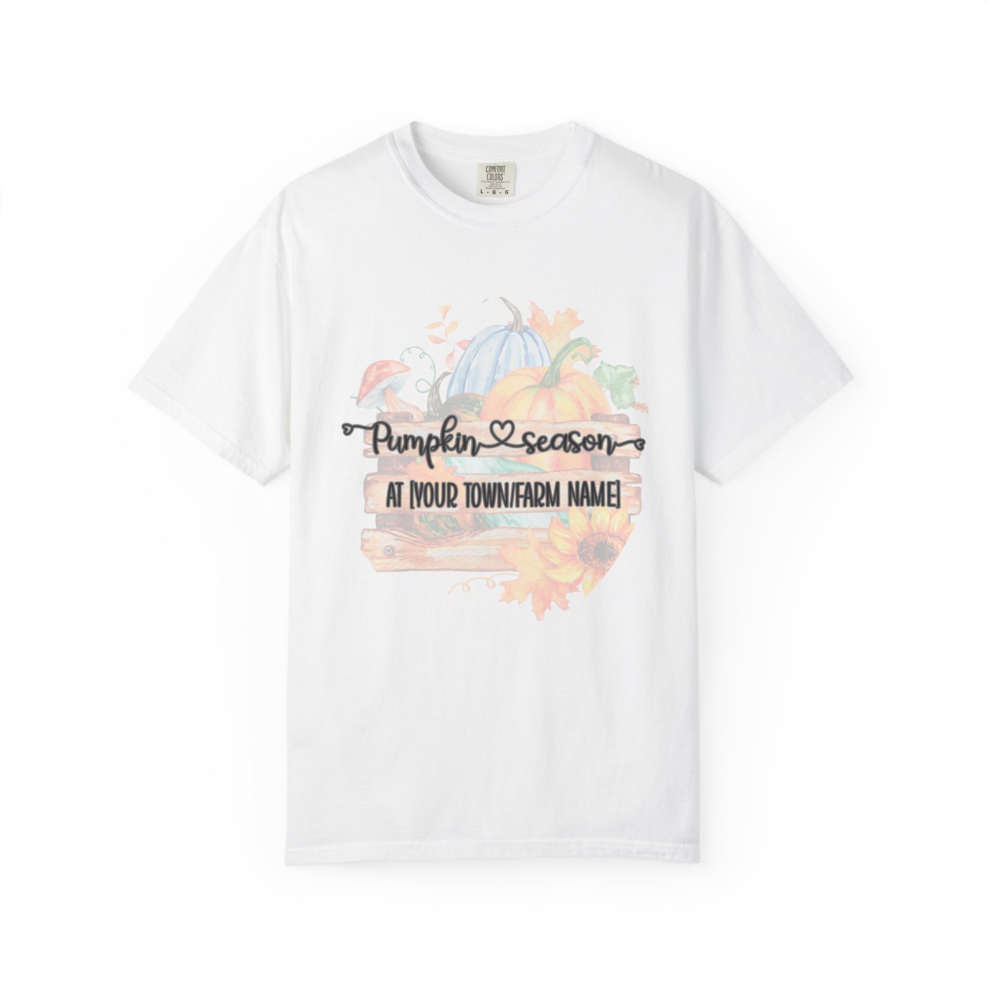 White t-shirt with pumpkin season graphic and placeholder text on a white background