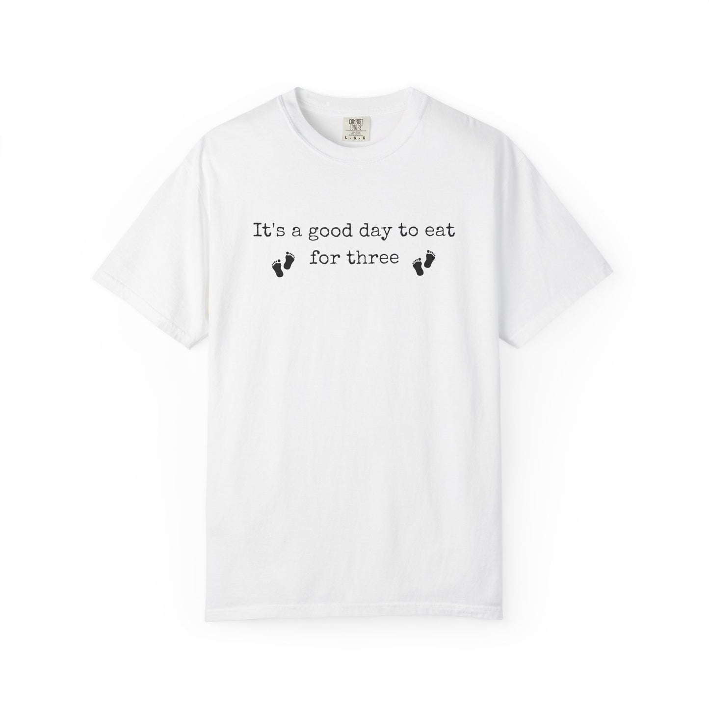 White t-shirt with text 'It's a good day to eat for three' on a white background