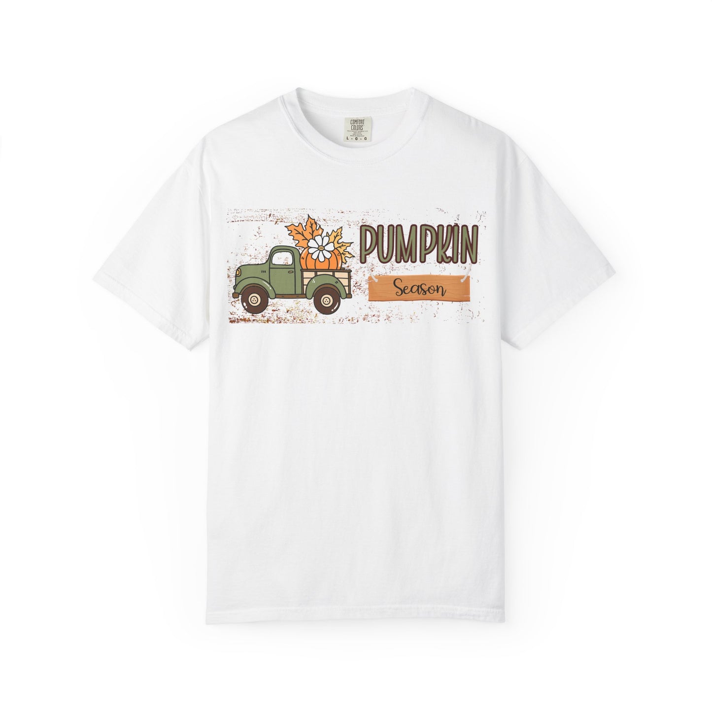 White t-shirt with a graphic of a truck and pumpkins and the text 'Pumpkin Season' on a white background.