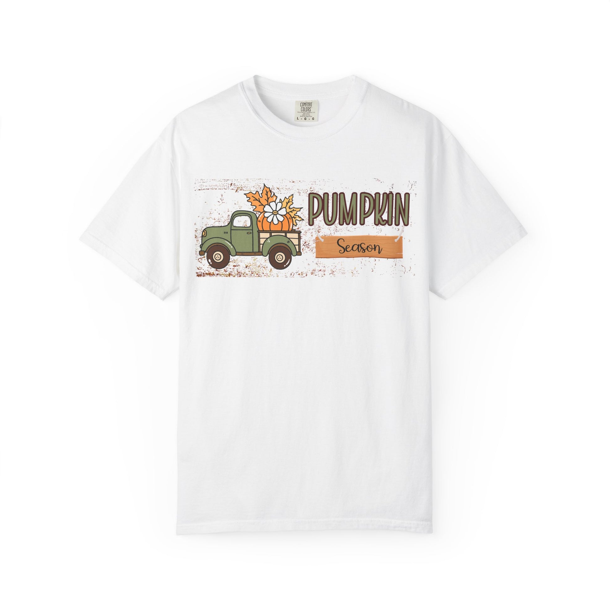 White t-shirt with a graphic of a truck and pumpkins and the text 'Pumpkin Season' on a white background.