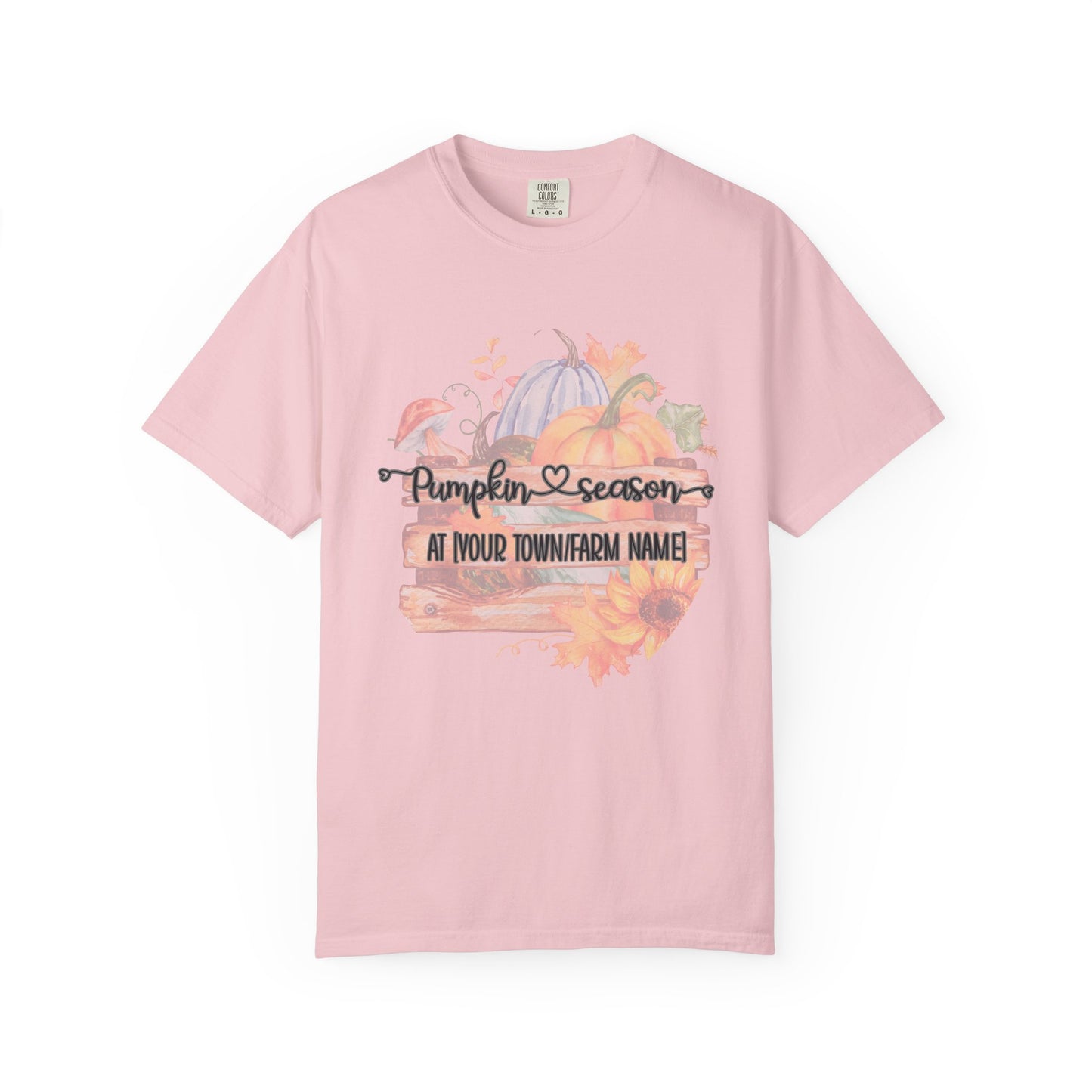 Pink t-shirt with pumpkin season design on a white background