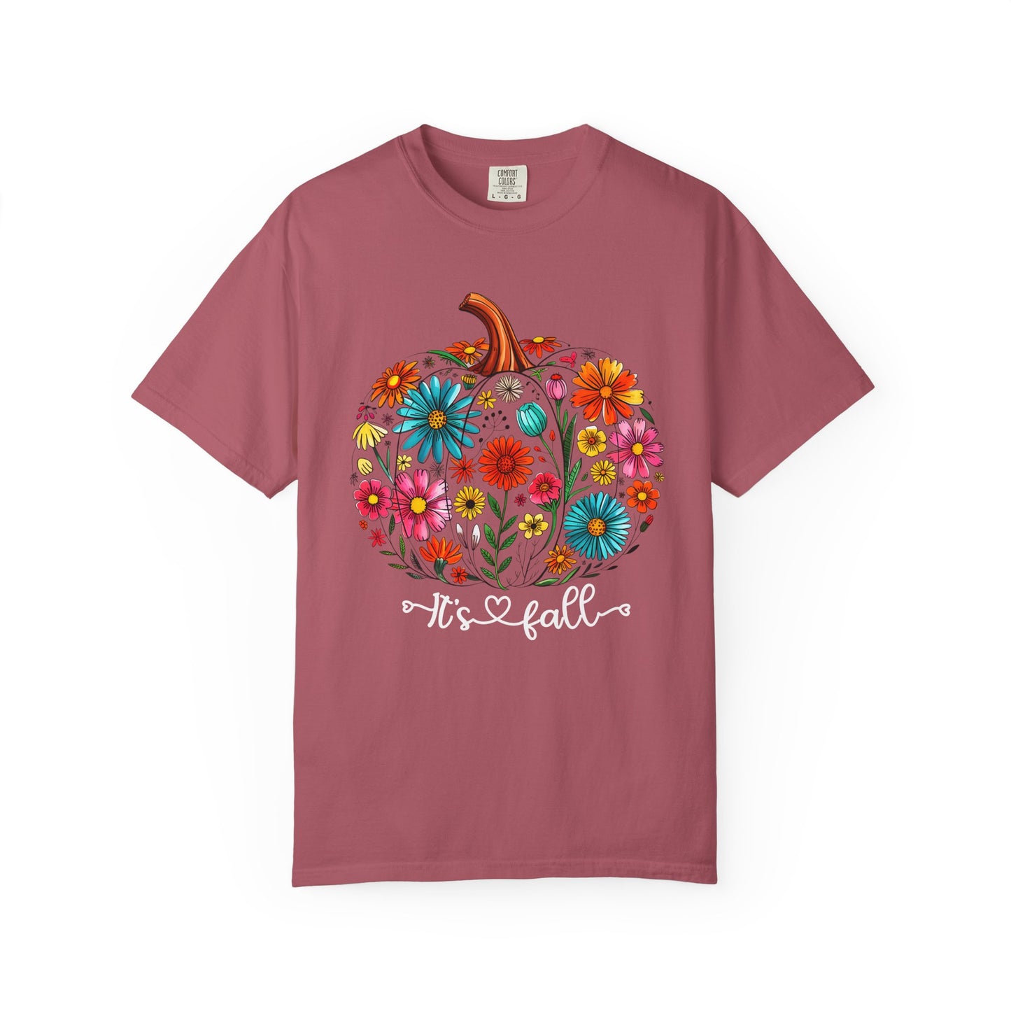 Pink t-shirt with a colorful pumpkin design and 'It's fall' text on a white background