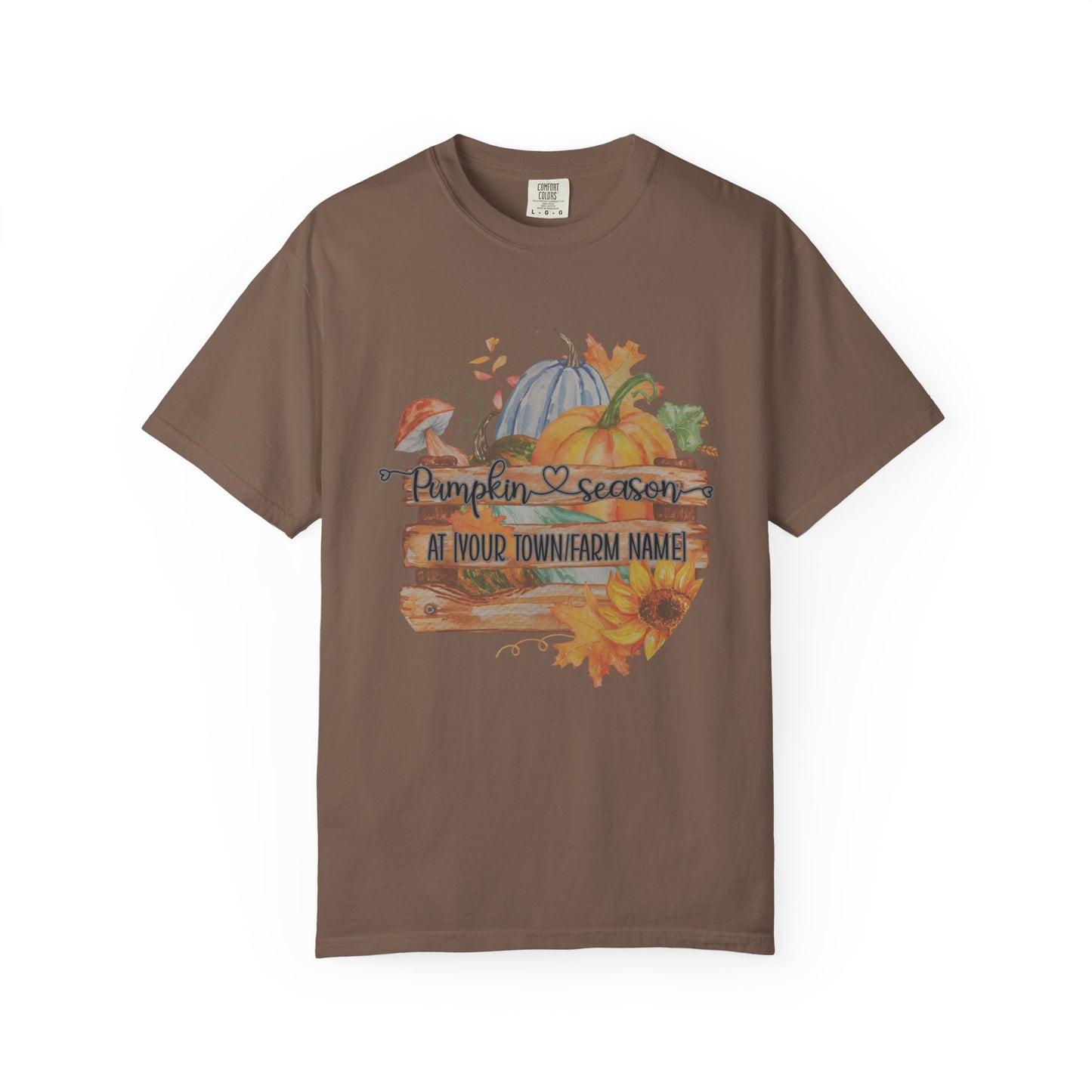 Brown t-shirt with autumn-themed design featuring pumpkins and sunflowers on a white background