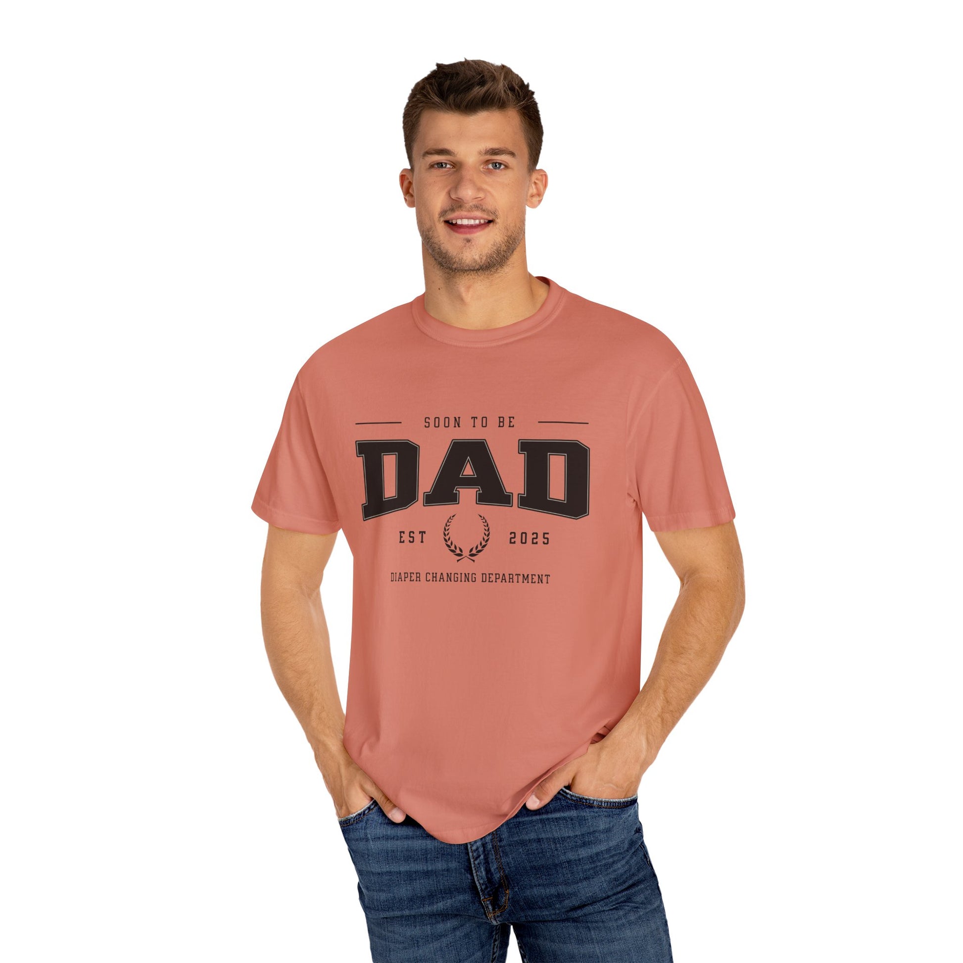 Man wearing a pink t-shirt with 'DAD' text on a white background
