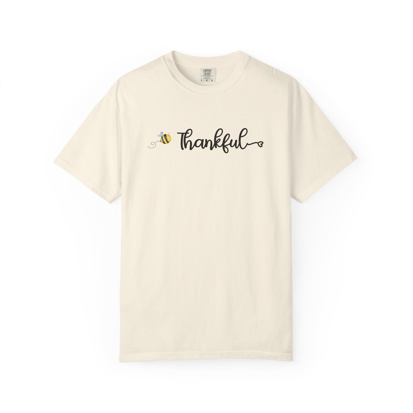 Beige t-shirt with 'Thankful' and bee design on a white background