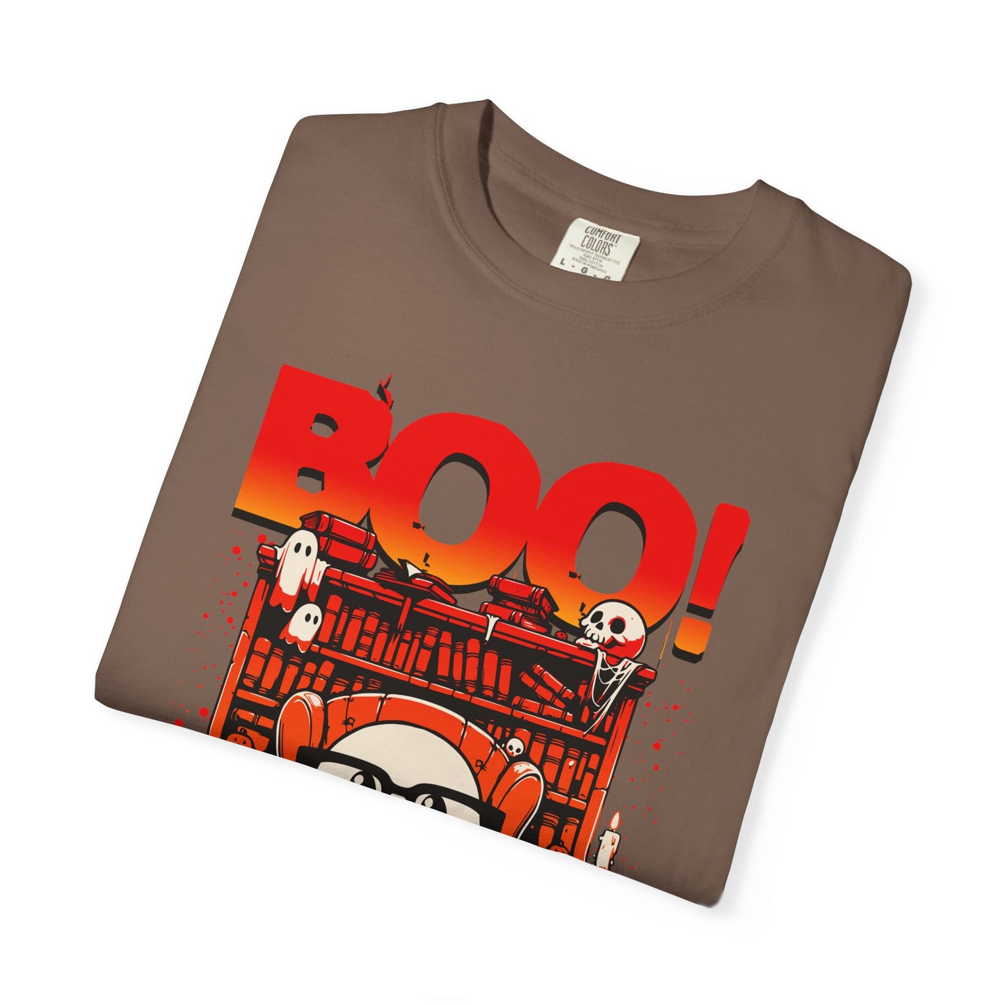 Folded brown t-shirt with Halloween-themed graphic and 'BOO!' text on a white background