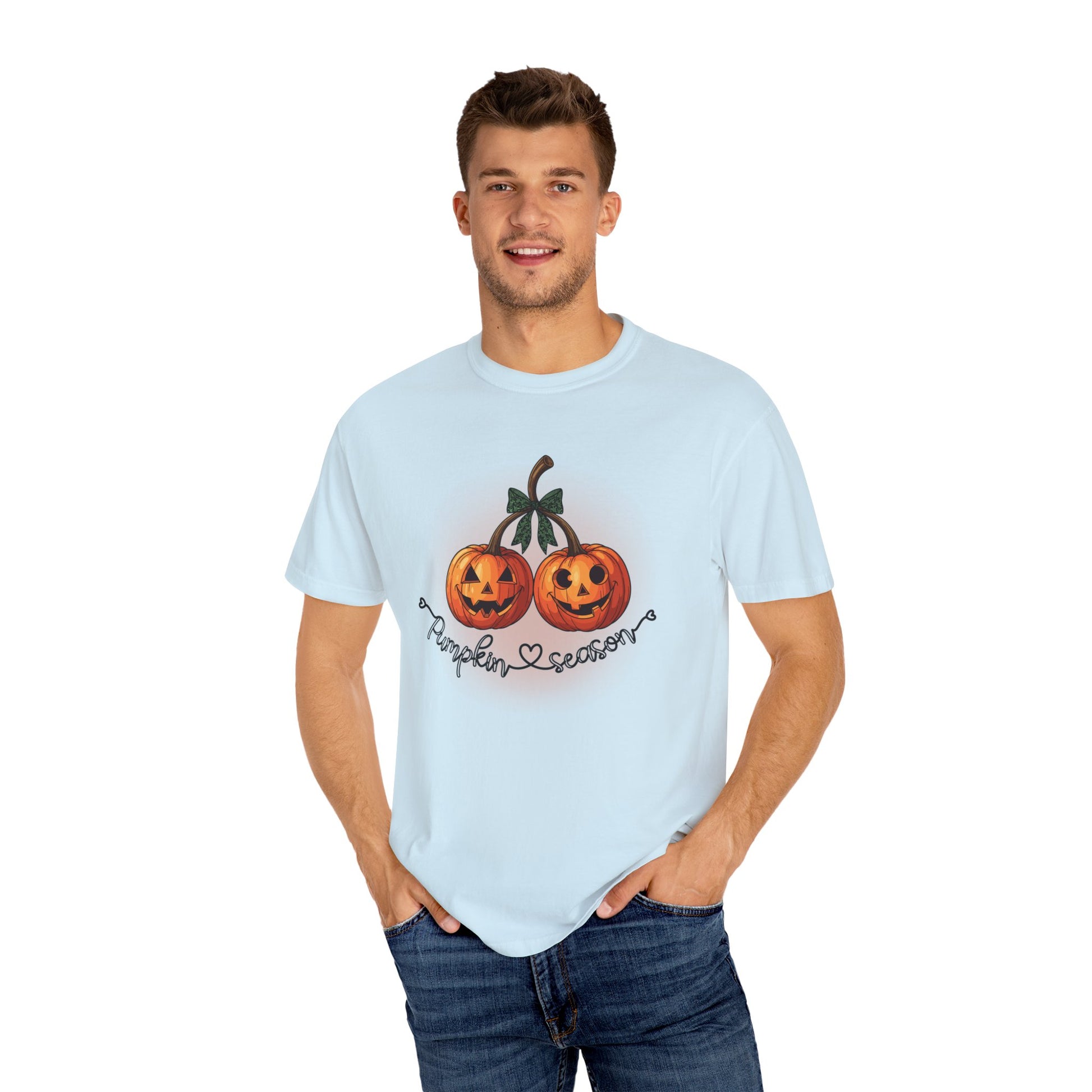 Man wearing a light blue t-shirt with Halloween-themed design on a white background