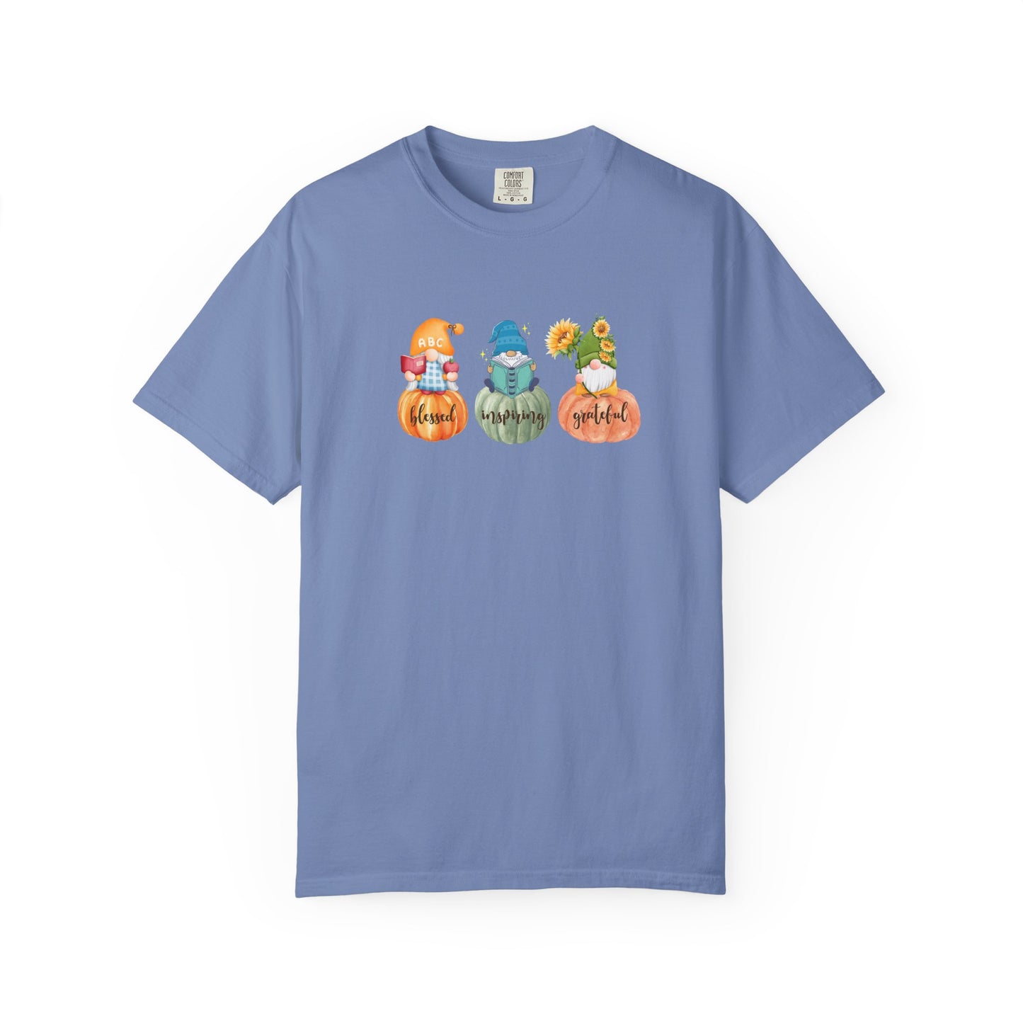 Blue t-shirt with gnomes and pumpkins design on a white background