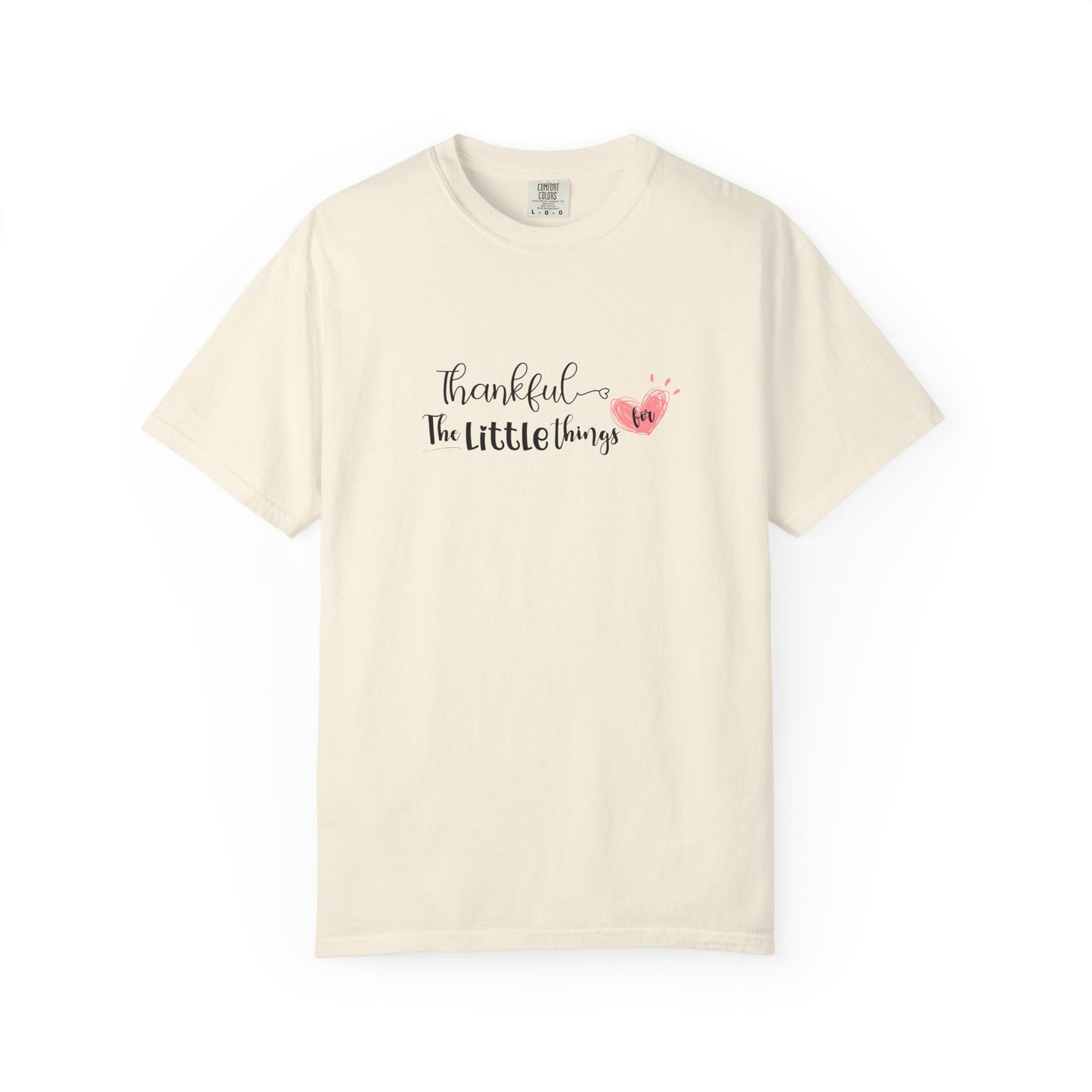 Beige t-shirt with 'Thankful for the little things' text and heart design on a white background