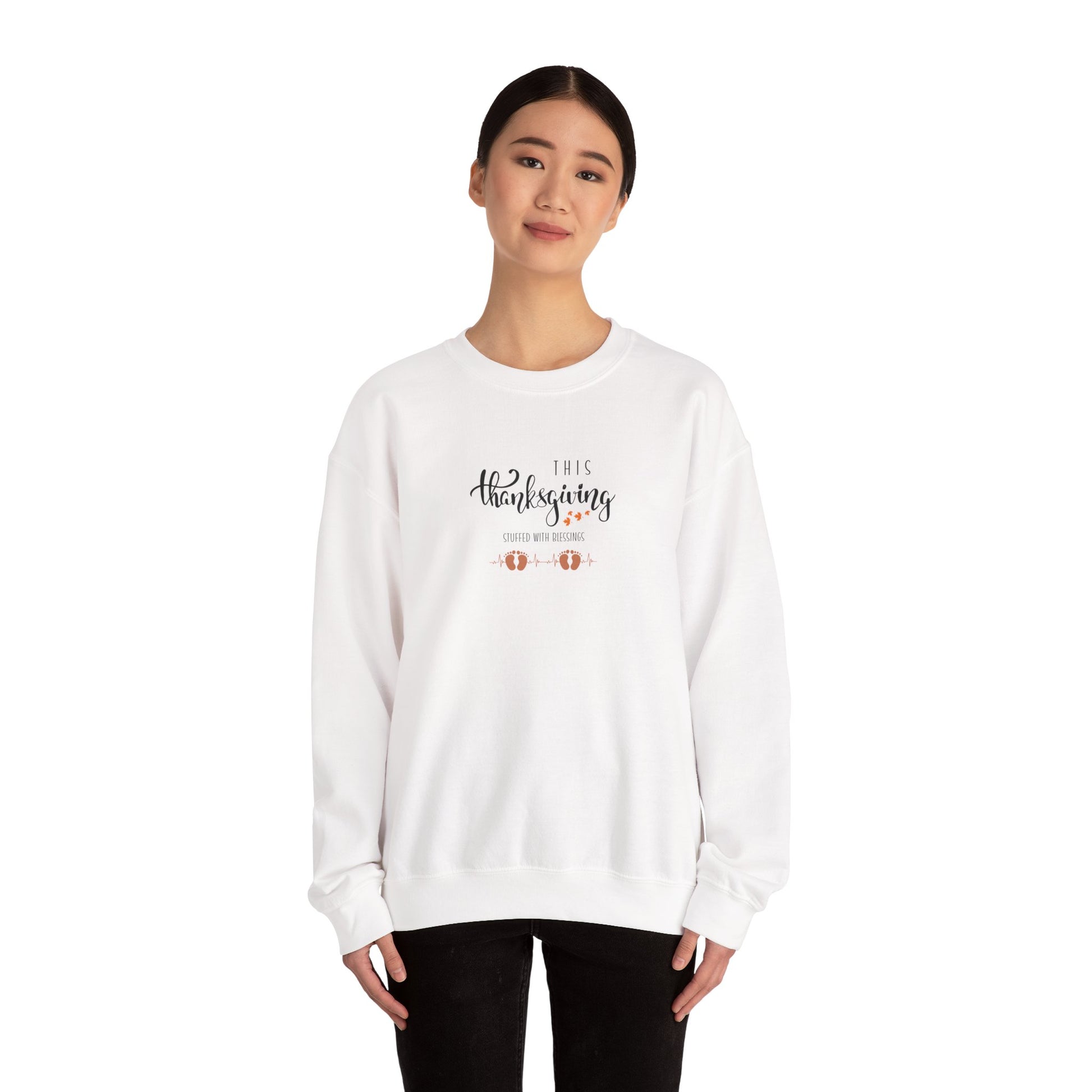 Person wearing a white sweatshirt with text and graphics on a white background