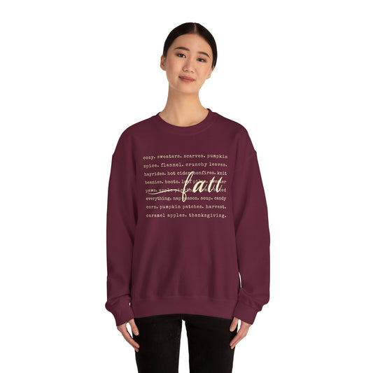 Person wearing a maroon sweatshirt with text design on a white background