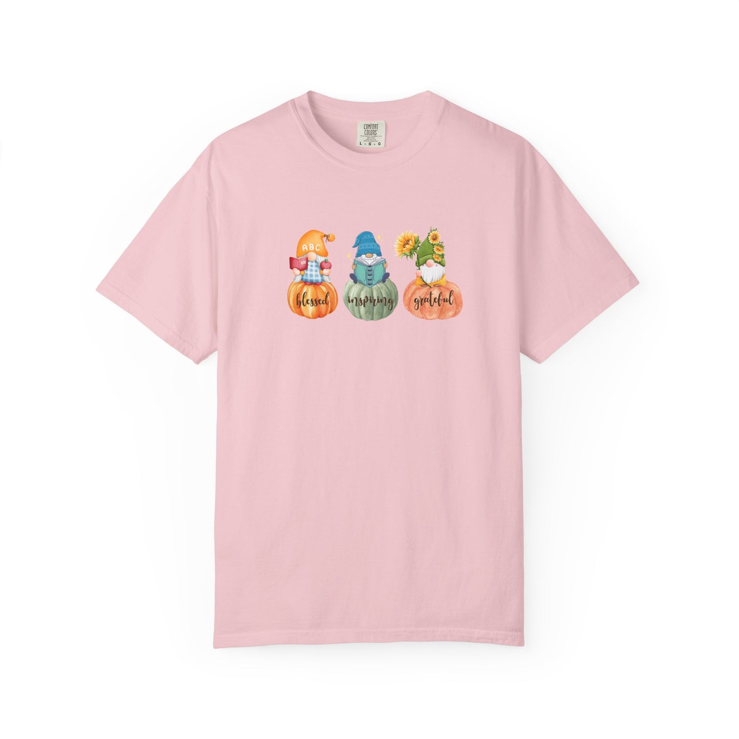 Pink t-shirt with cartoon gnomes and pumpkins on a white background