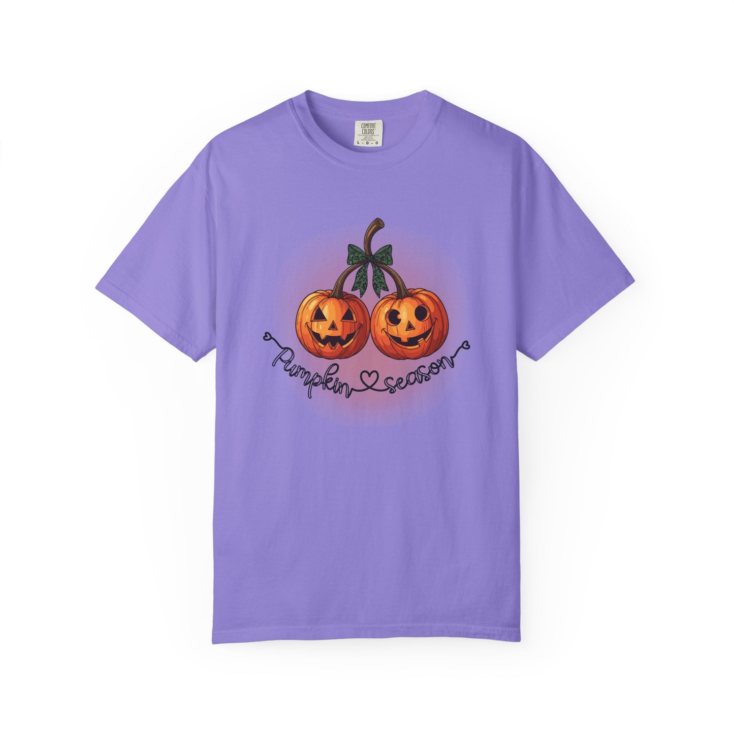 Purple t-shirt with Halloween-themed design of two pumpkins and text on a white background