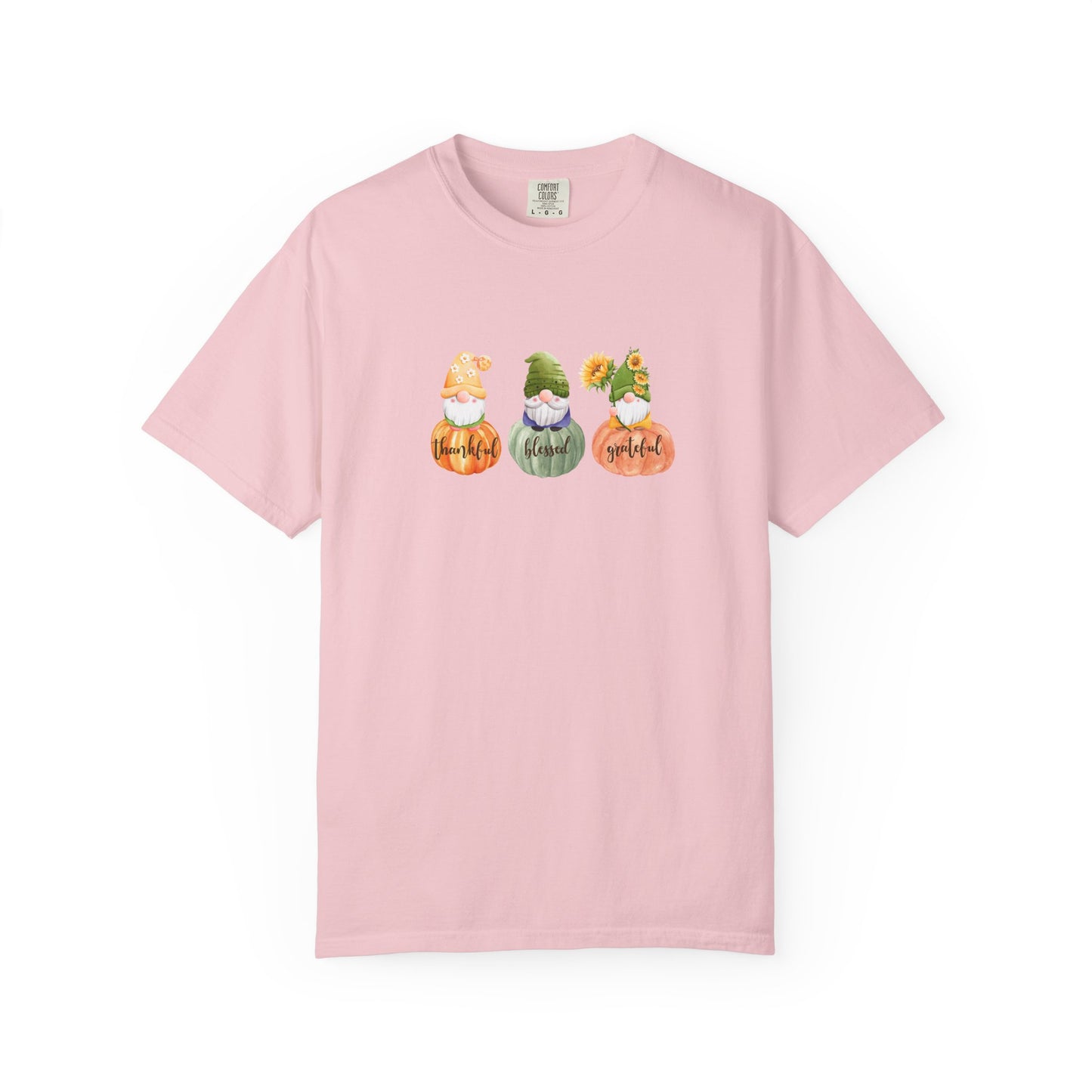 Pink t-shirt with gnomes and pumpkins design on a white background