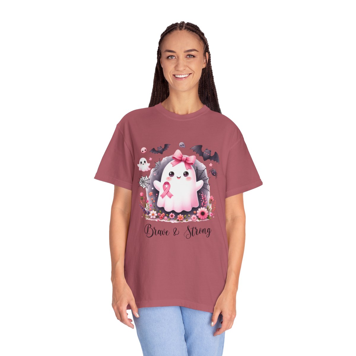 Person wearing a maroon t-shirt with a cartoon ghost and pink ribbon design on a white background
