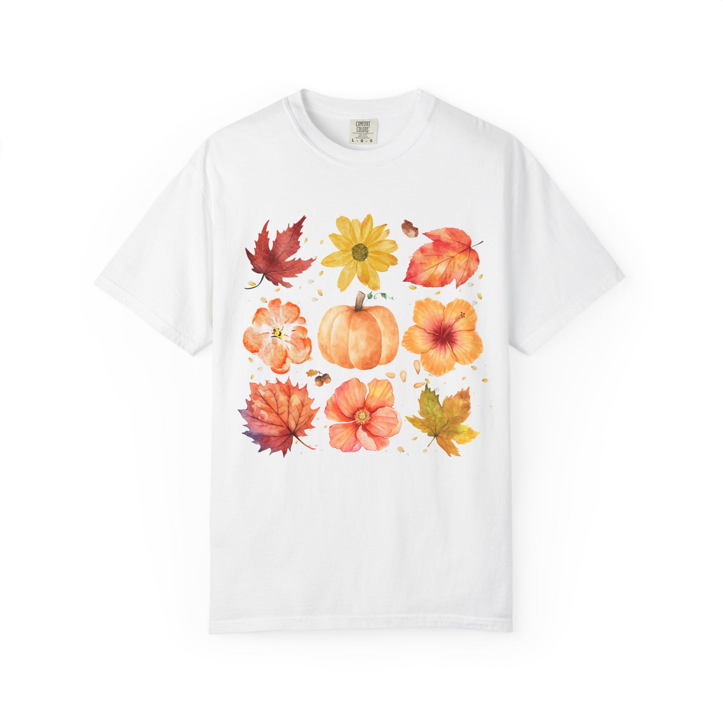 White t-shirt with autumn-themed design featuring leaves and pumpkins on a white background