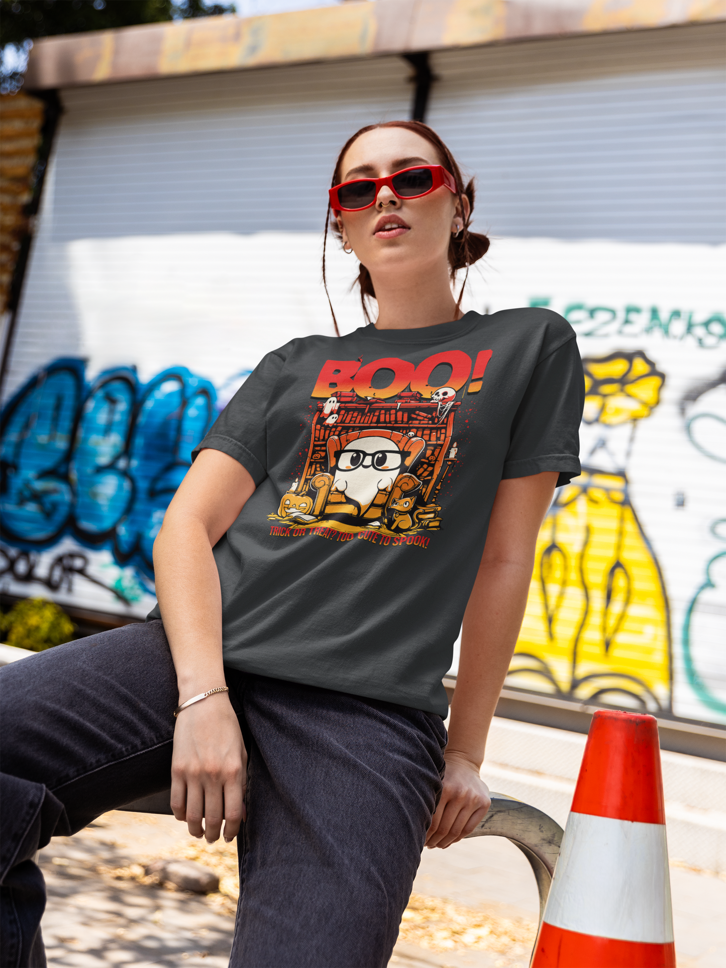 Person wearing a t-shirt with a graphic design in an urban setting