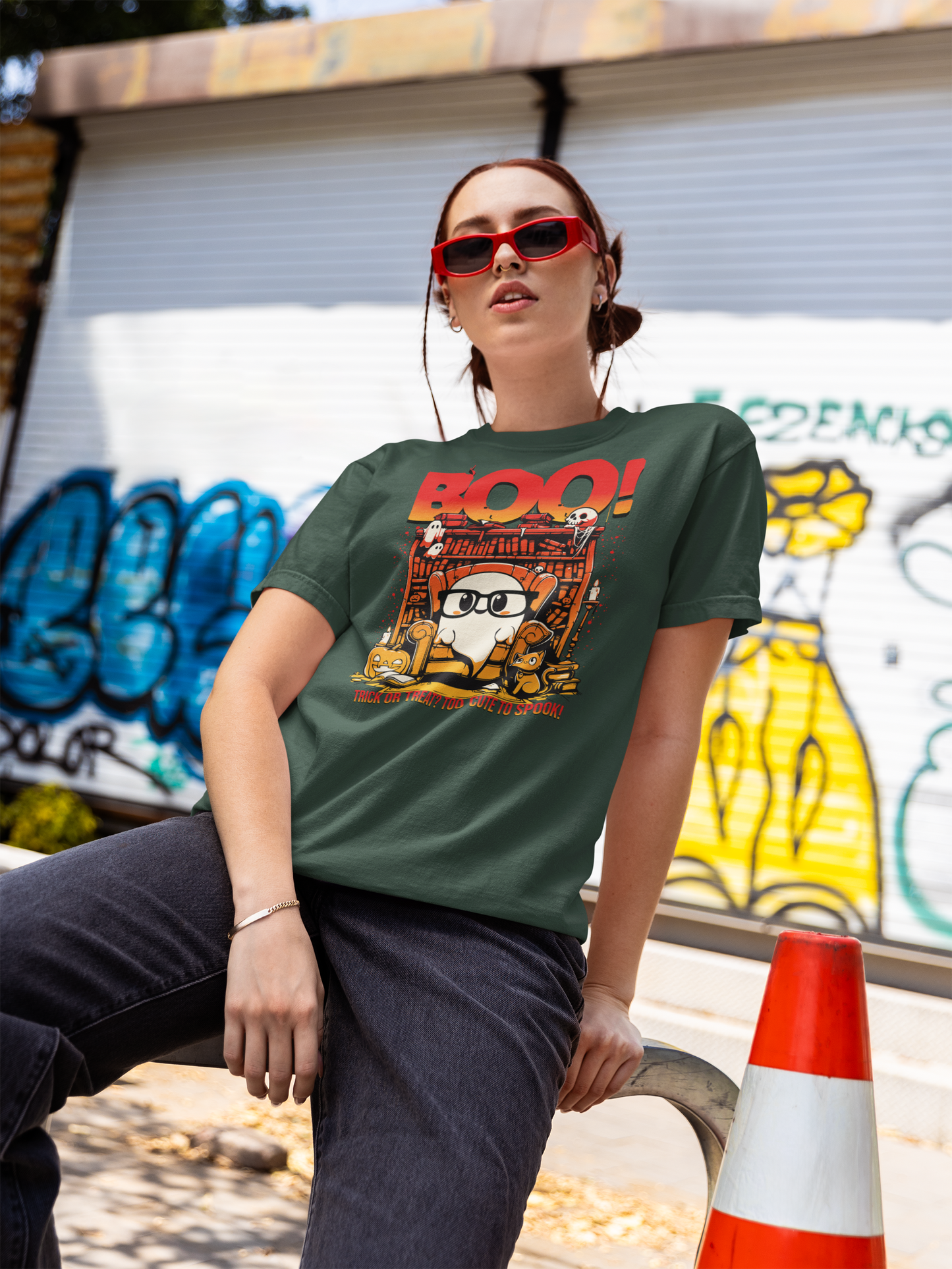 Person wearing a green t-shirt with a graphic design in an urban setting