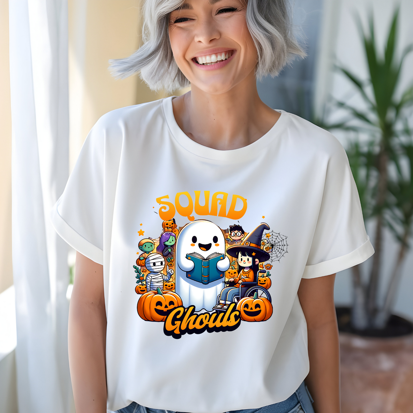 Person wearing a white t-shirt with Halloween-themed graphics and text.