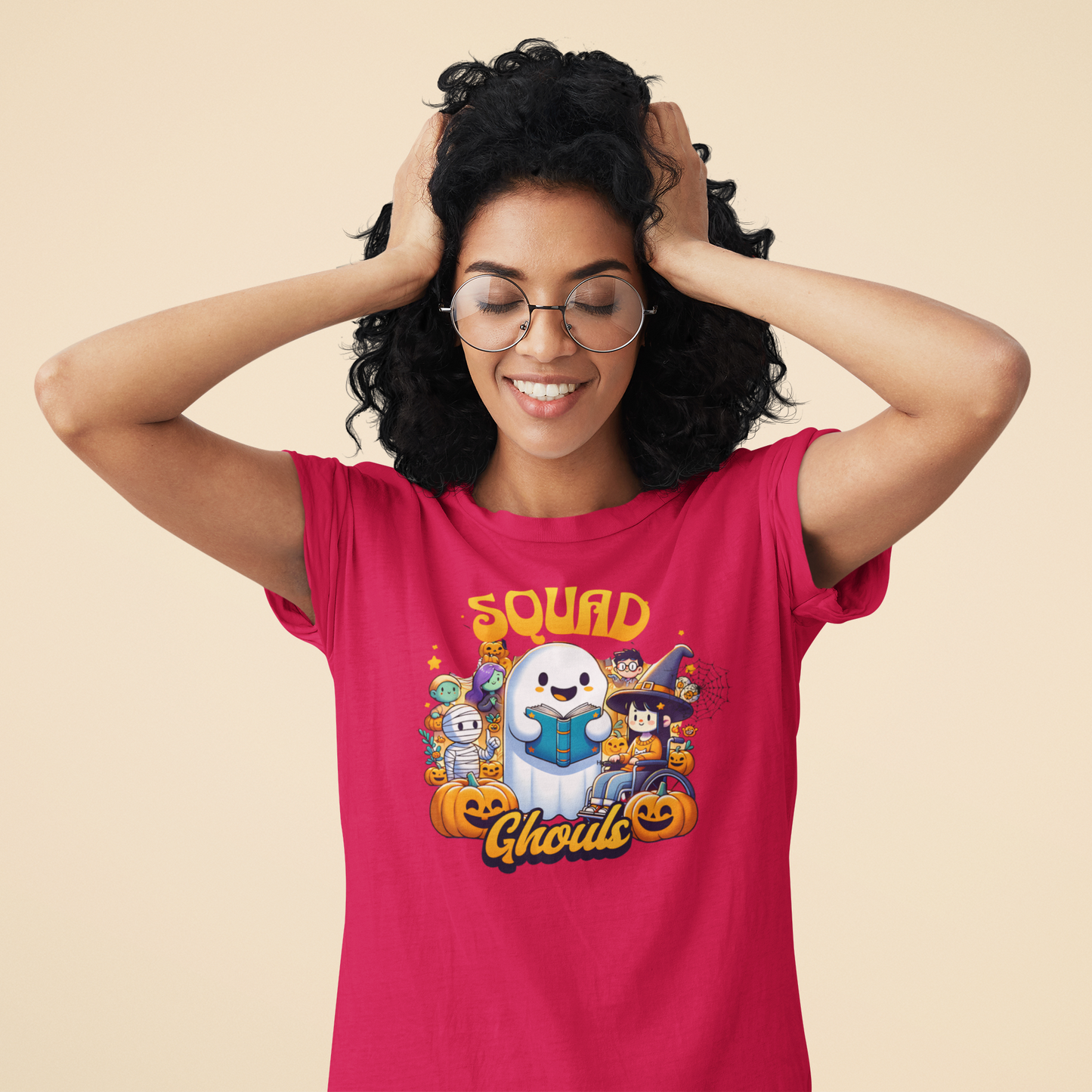 Woman wearing a pink t-shirt with a Halloween-themed graphic and text.