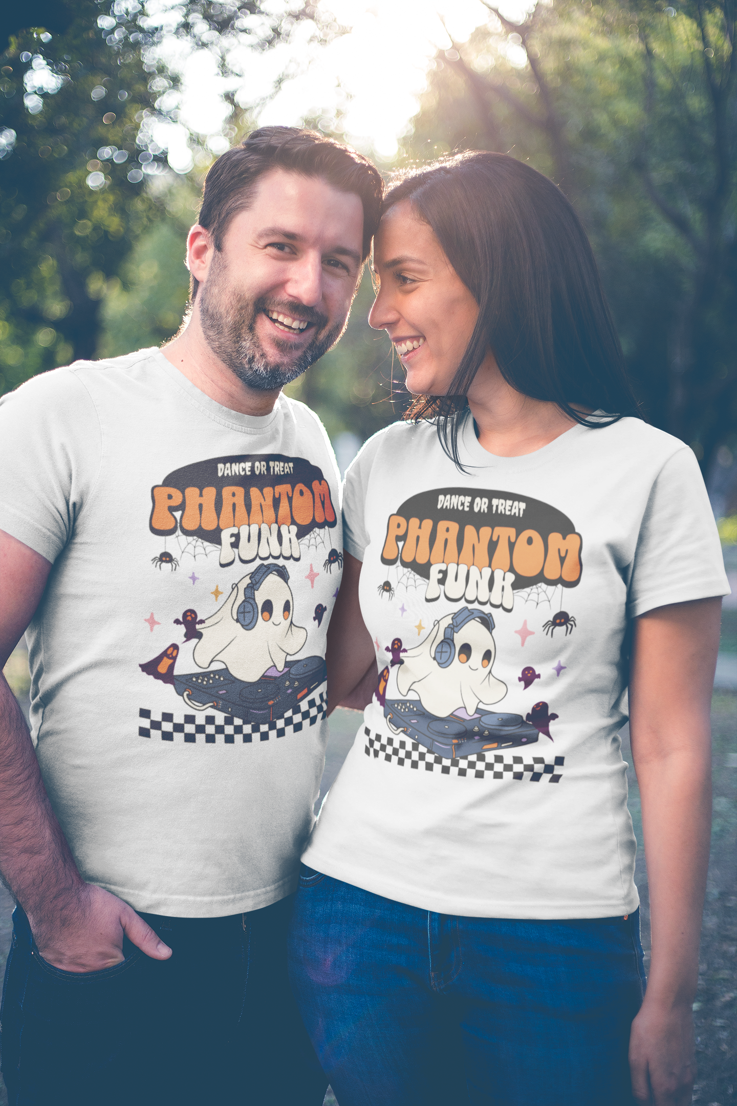 Two people wearing matching t-shirts with a cartoon character and text in an outdoor setting.