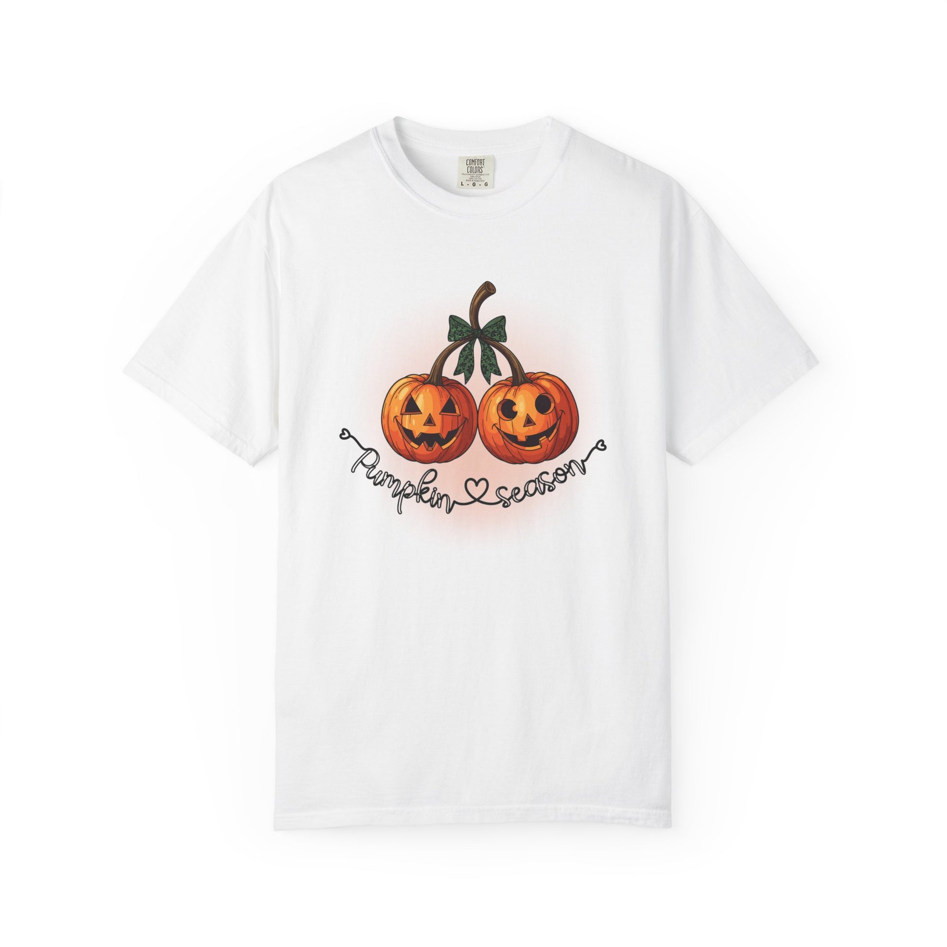 White t-shirt with pumpkin design and text on a white background