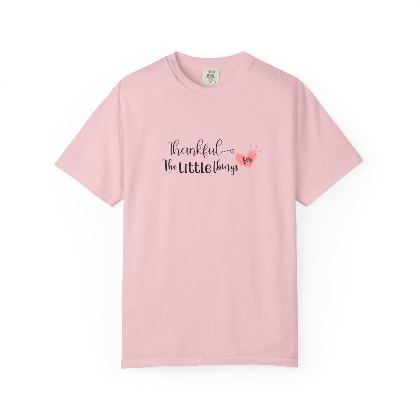 Pink t-shirt with text and heart design on a white background