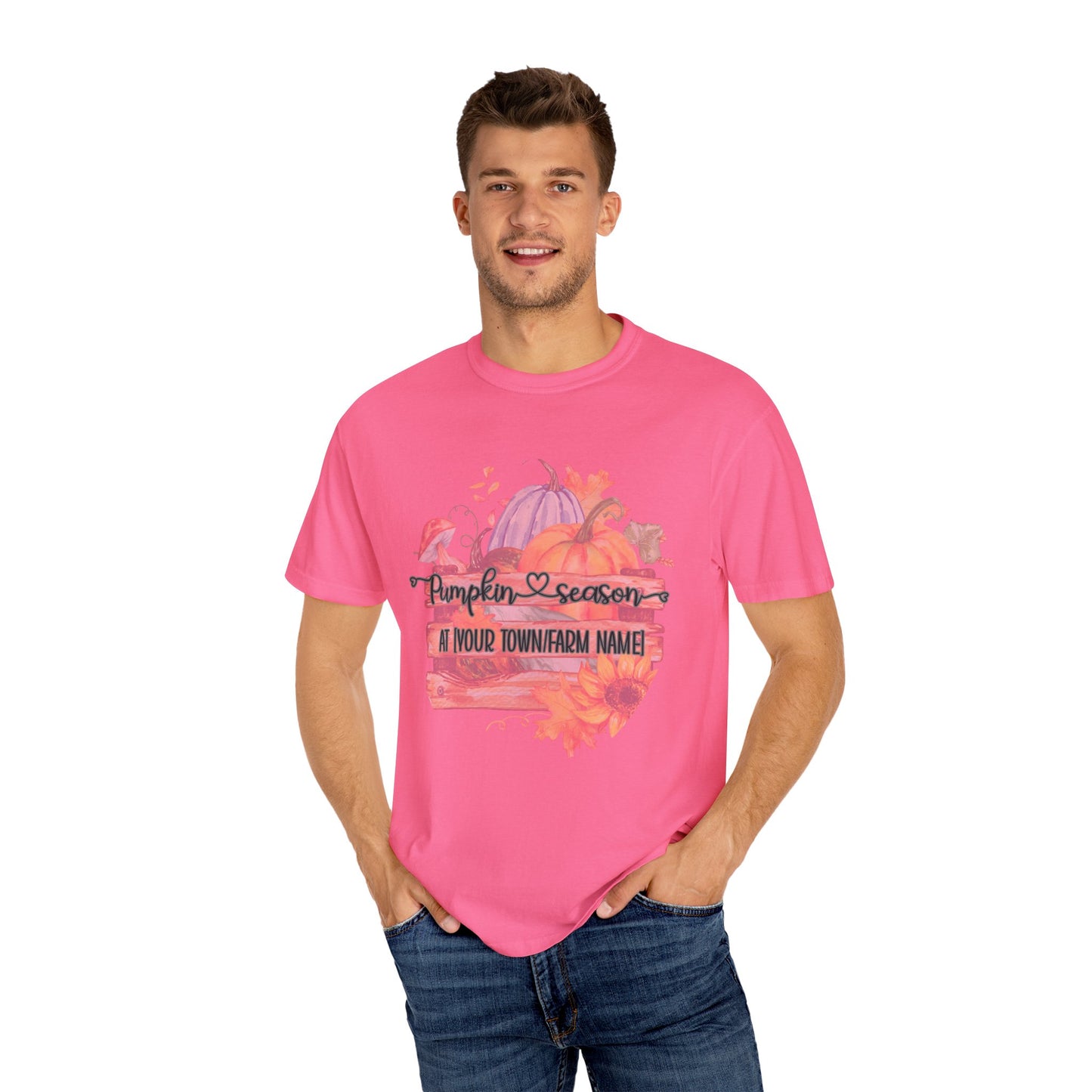 Man wearing a pink t-shirt with a pumpkin patch graphic and text.