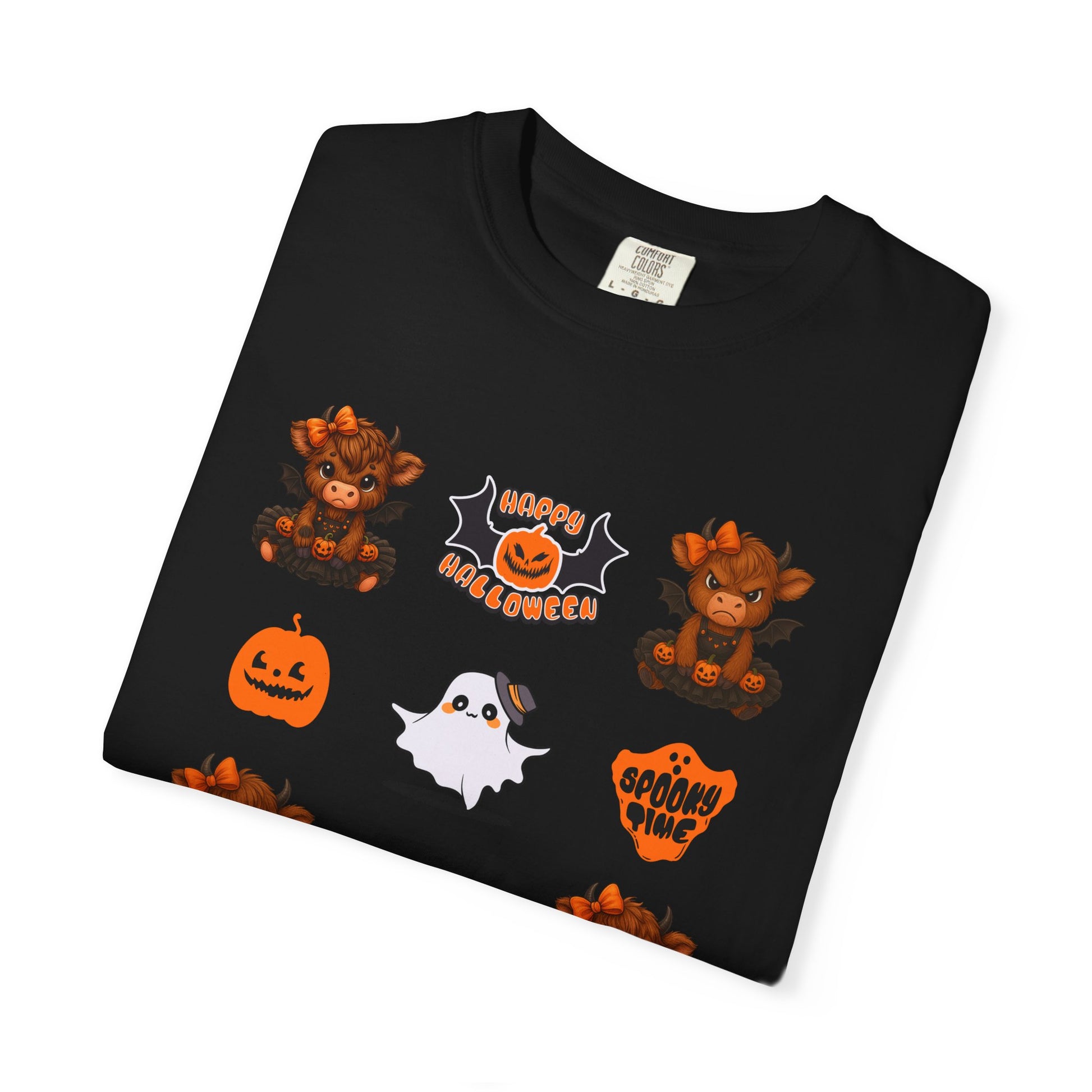 Folded black t-shirt with Halloween-themed graphics on a white background