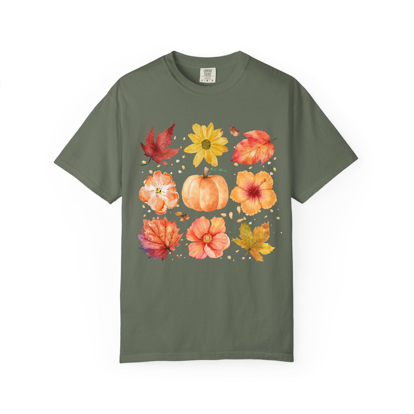 Green t-shirt with autumn-themed design featuring leaves, flowers, and pumpkins on a white background.