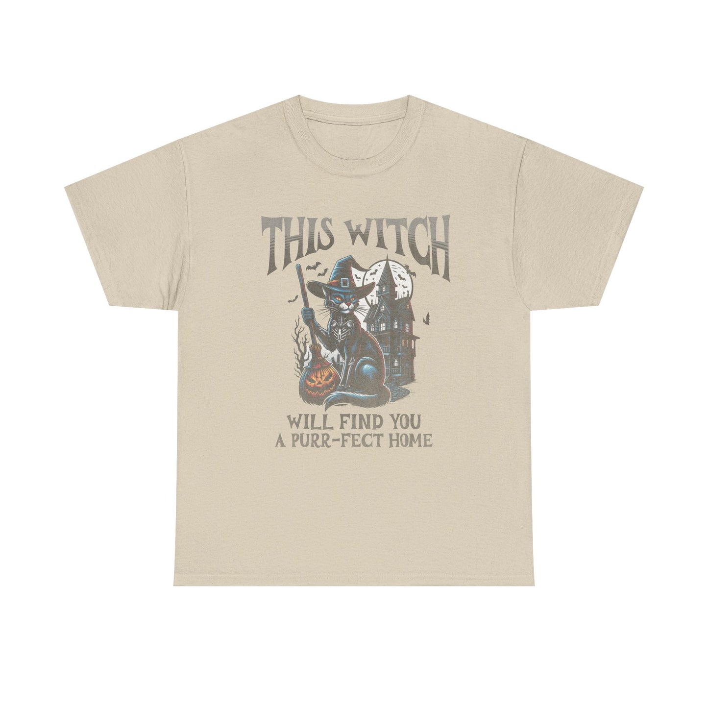 Beige t-shirt with a graphic of a witch and cat, text 'This Witch Will Find You a Purr-fect Home', on a white background.