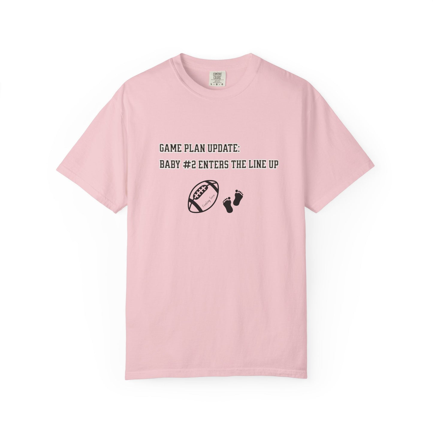 Pink t-shirt with text and graphics on a white background