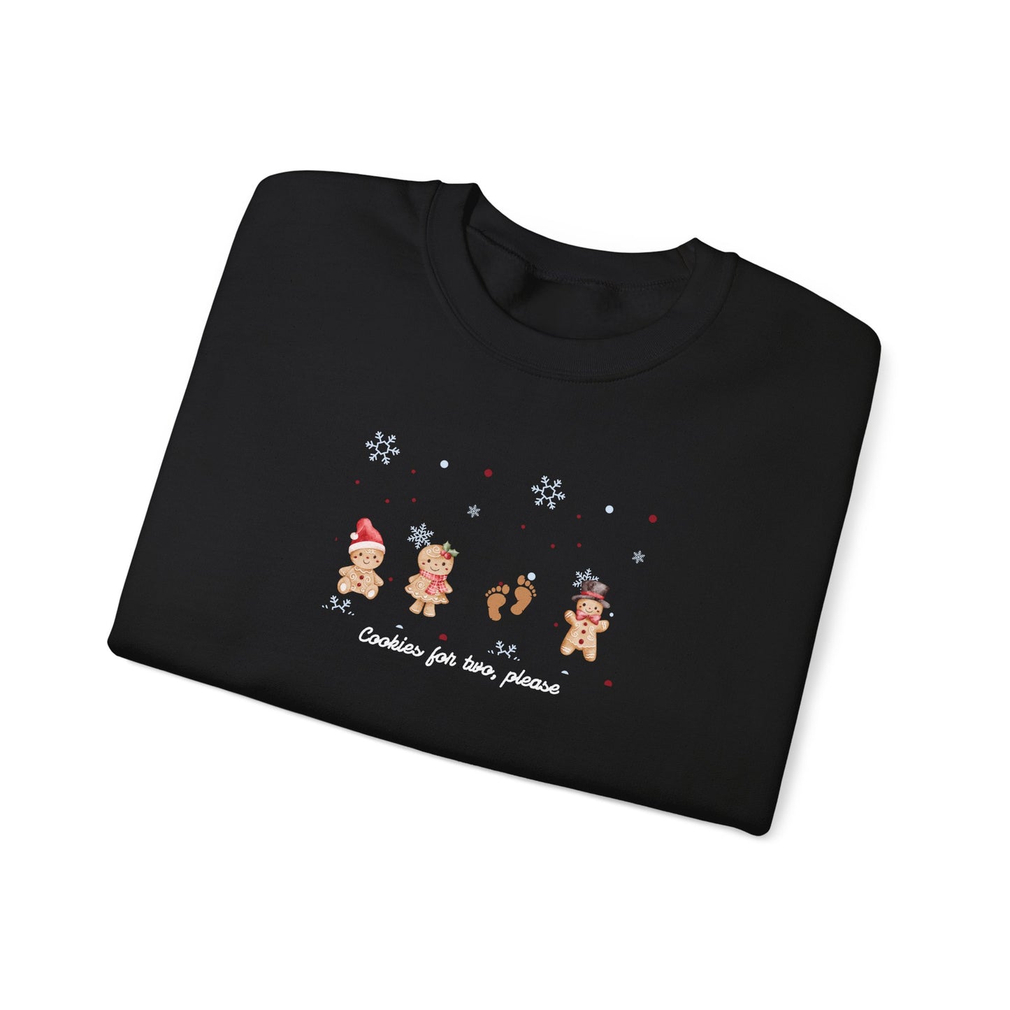Folded black sweater with Christmas-themed design on a white background