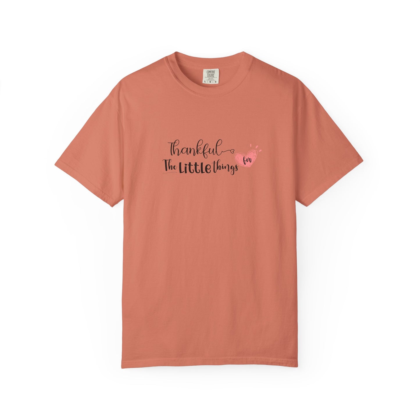 Coral t-shirt with 'Thankful for the little things' text on a white background