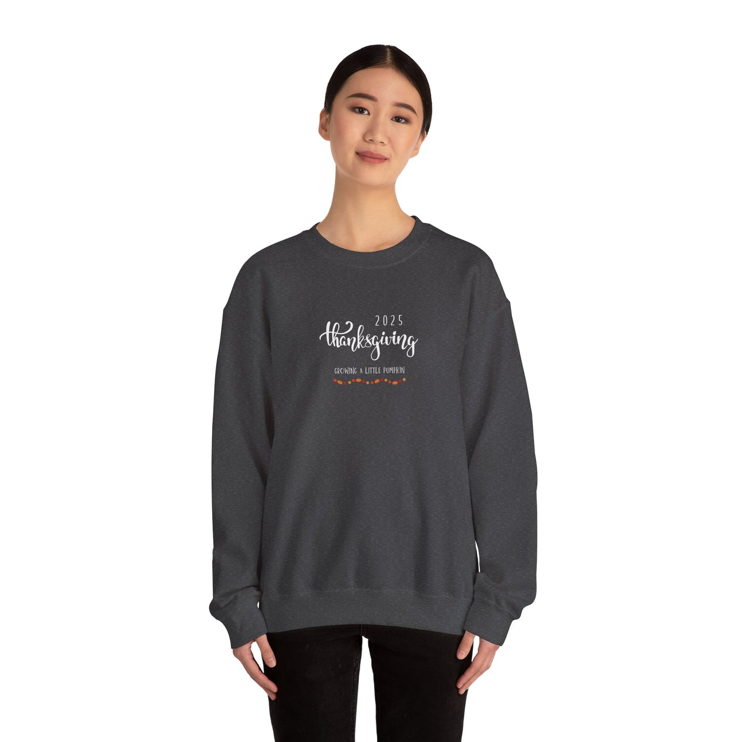 Person wearing a dark gray sweatshirt with '2023 Thanksgiving' text on a white background