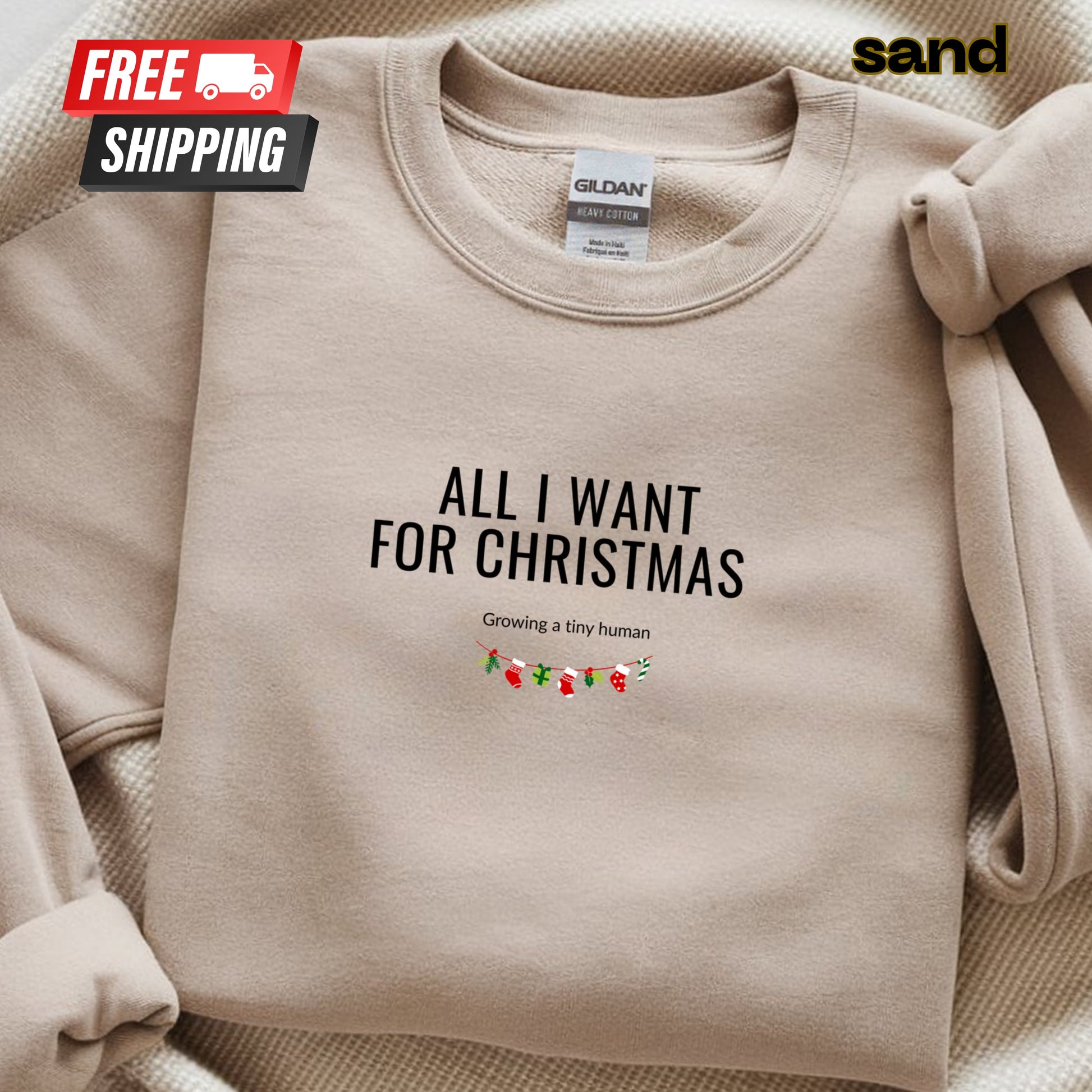 Beige sweatshirt with text 'All I Want for Christmas' on a beige background