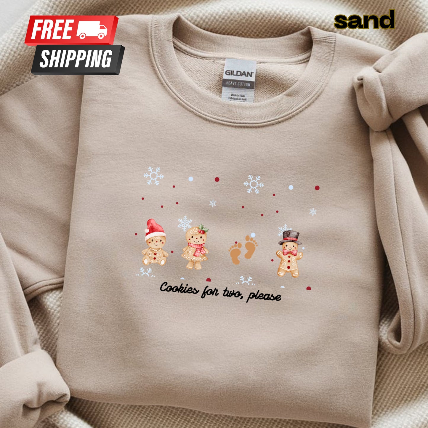 Beige sweatshirt with Christmas-themed design and 'sand' brand label.