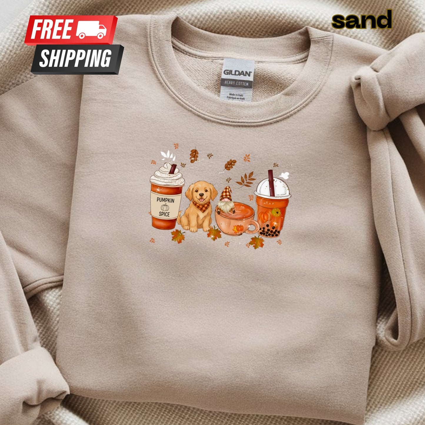 Beige sweatshirt with a graphic of a dog, coffee cups, and leaves on a beige background.