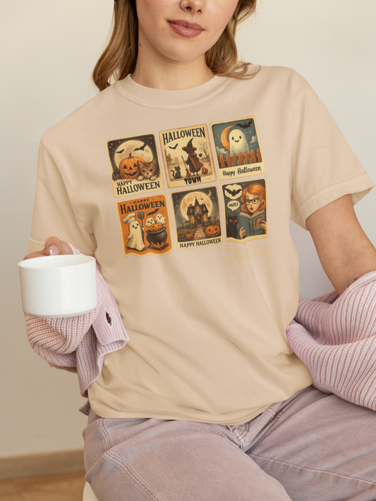 Person wearing a beige t-shirt with Halloween-themed graphic designs.