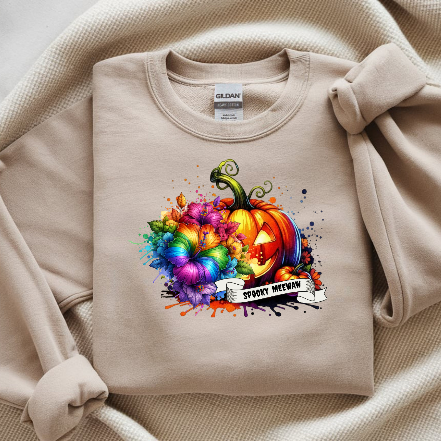 Beige sweatshirt with a colorful pumpkin design and 'Spooky Meow' text on a beige background