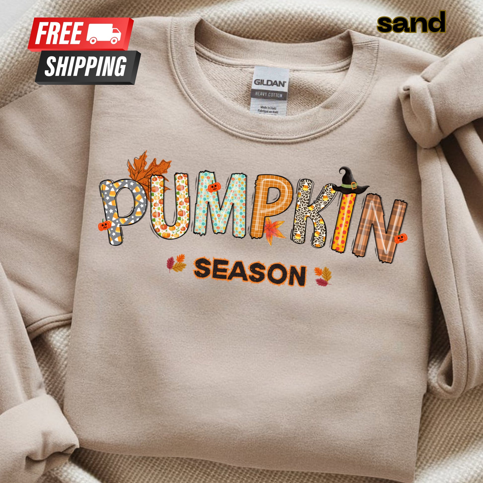 Beige sweatshirt with 'PUMPKIN SEASON' text and fall-themed design on a beige background.