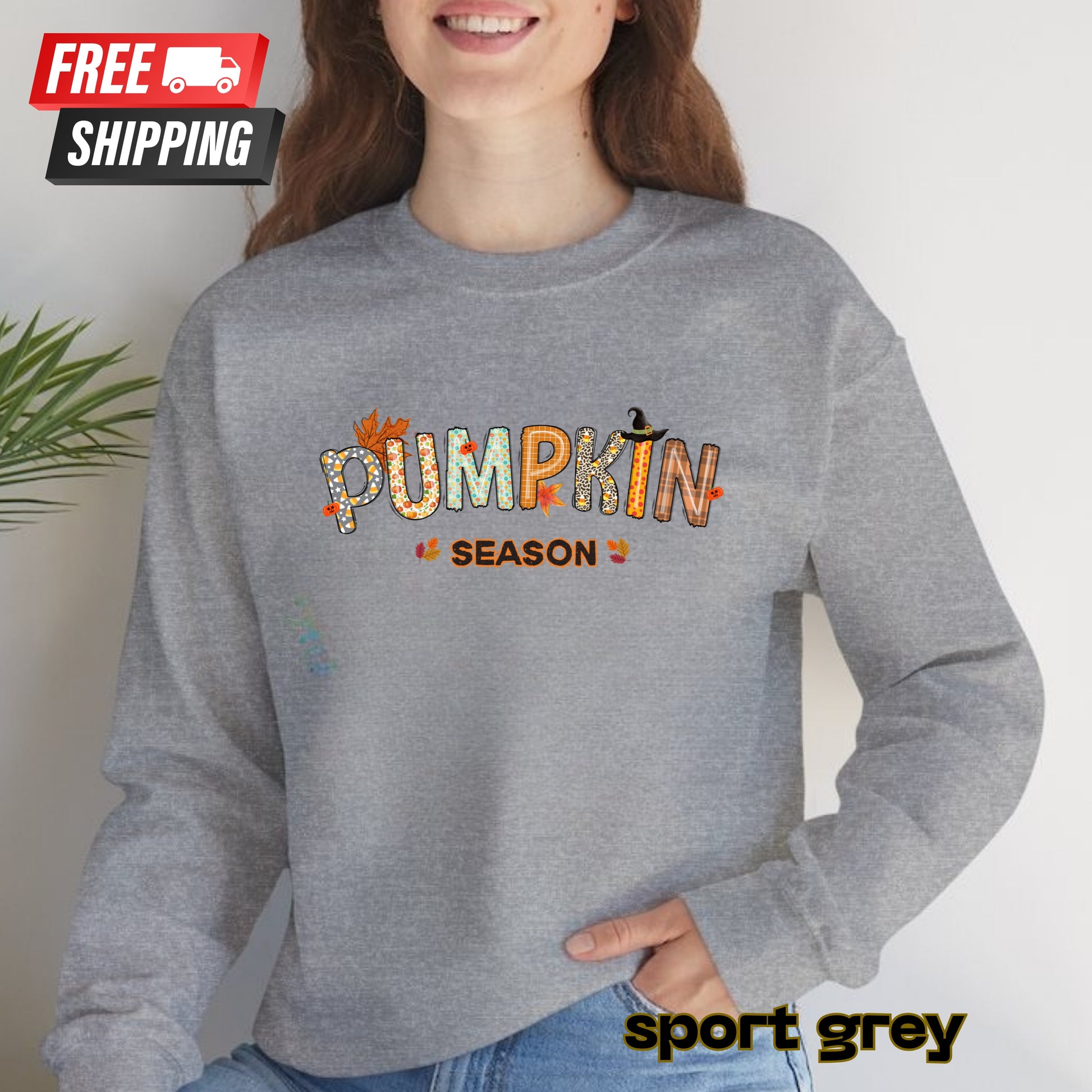 Person wearing a gray sweatshirt with 'Pumpkin Season' text, standing against a plain background.