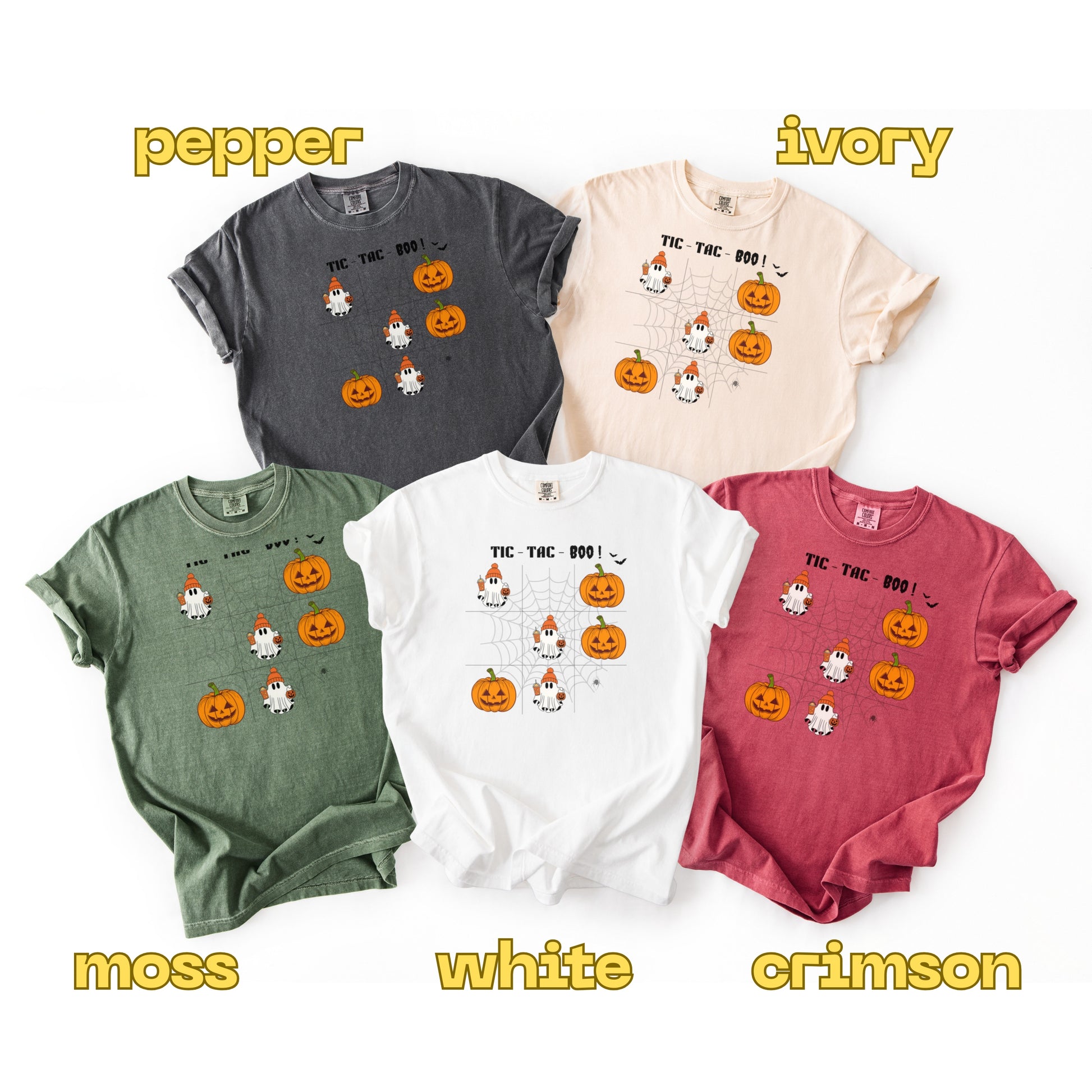 Five Halloween-themed t-shirts in different colors with text labels below each.