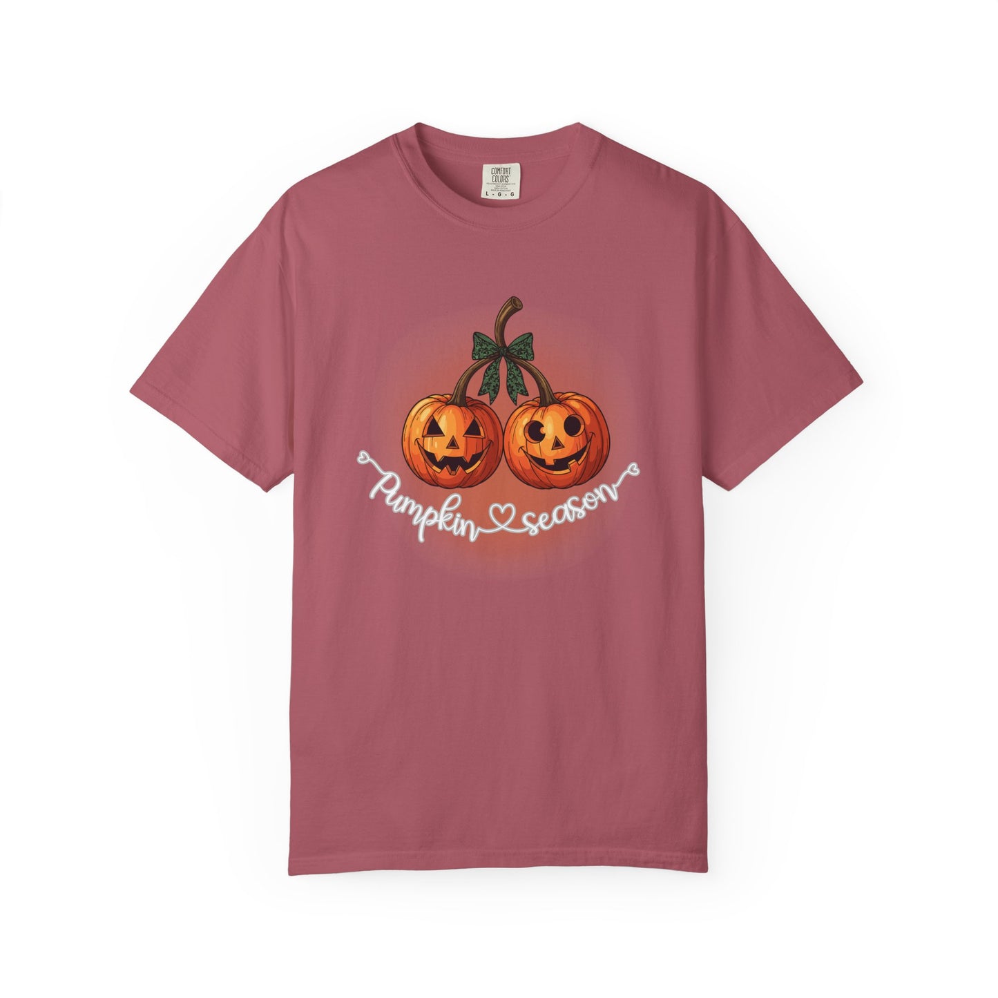Pink t-shirt with pumpkin design and 'Pumpkin Season' text on a white background