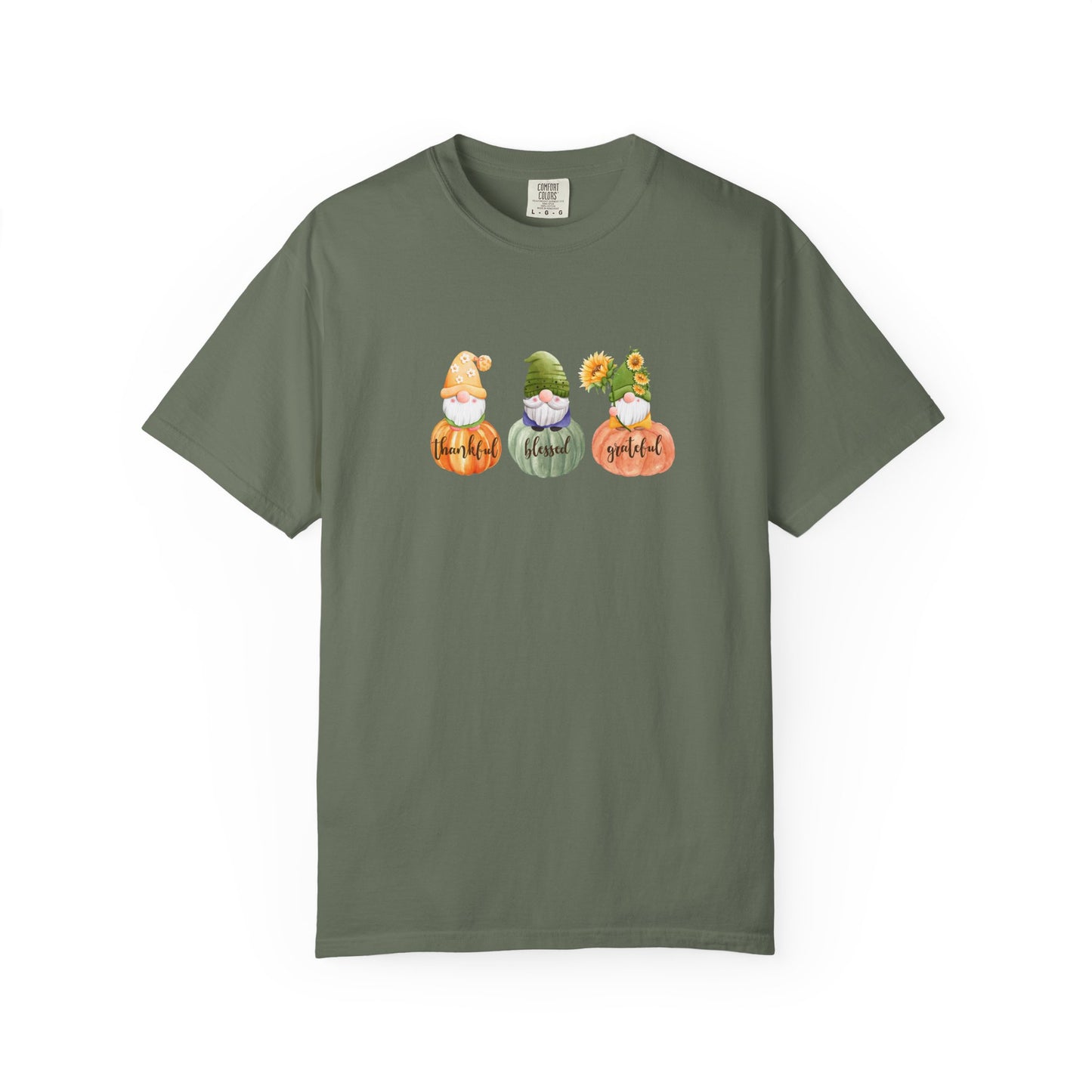 Green t-shirt with three cartoon gnomes and text on a white background
